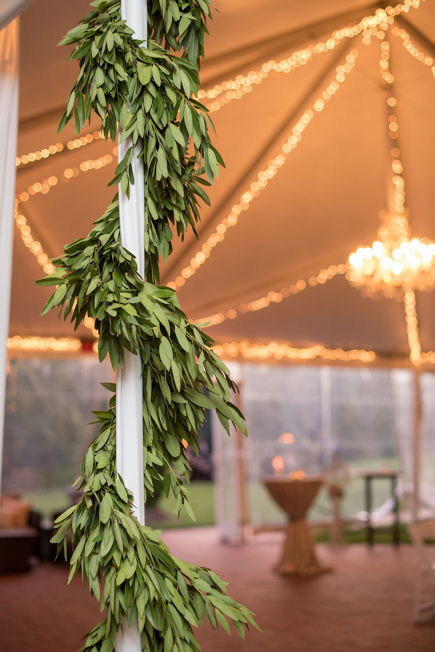 Pavilion at Angus Barn wedding photos by Mikkel Paige Photography. Picture of garland decoration on a pole inside the tent.