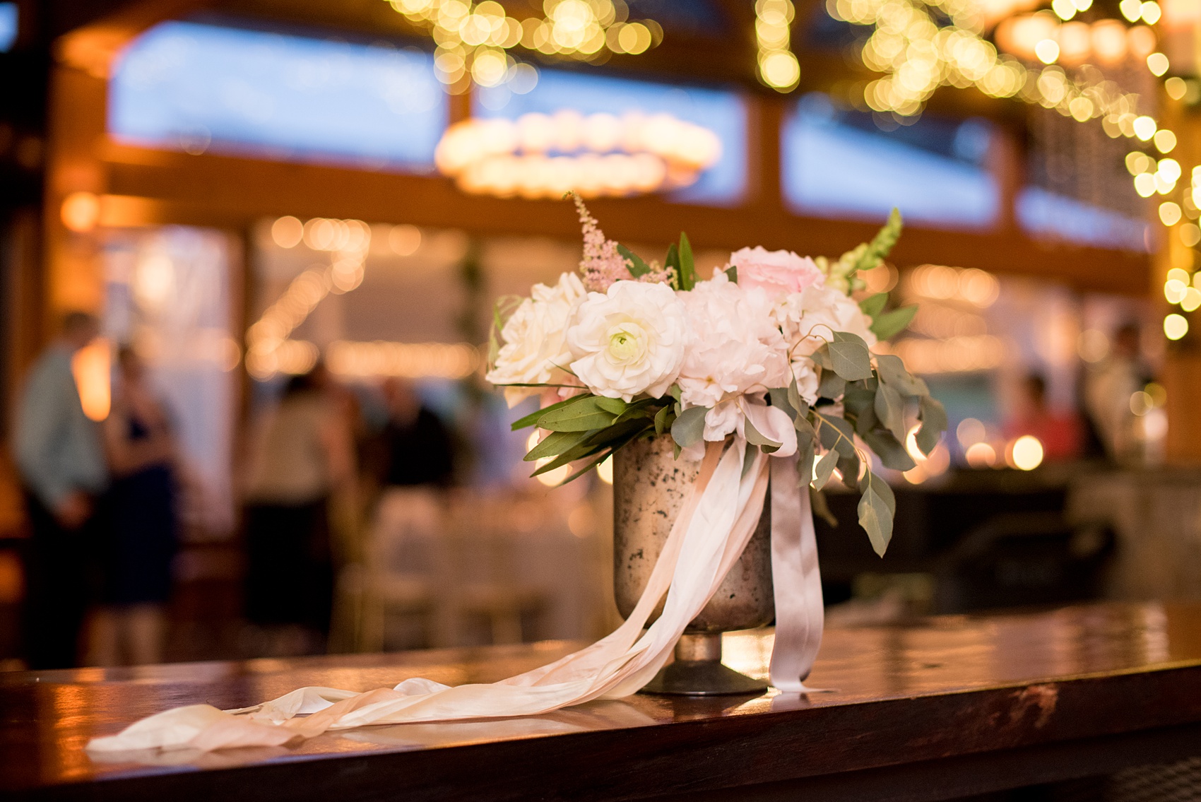 Pavilion at Angus Barn wedding photos by Mikkel Paige Photography. Picture of one of the bouquets at the reception by Meristem Floral.