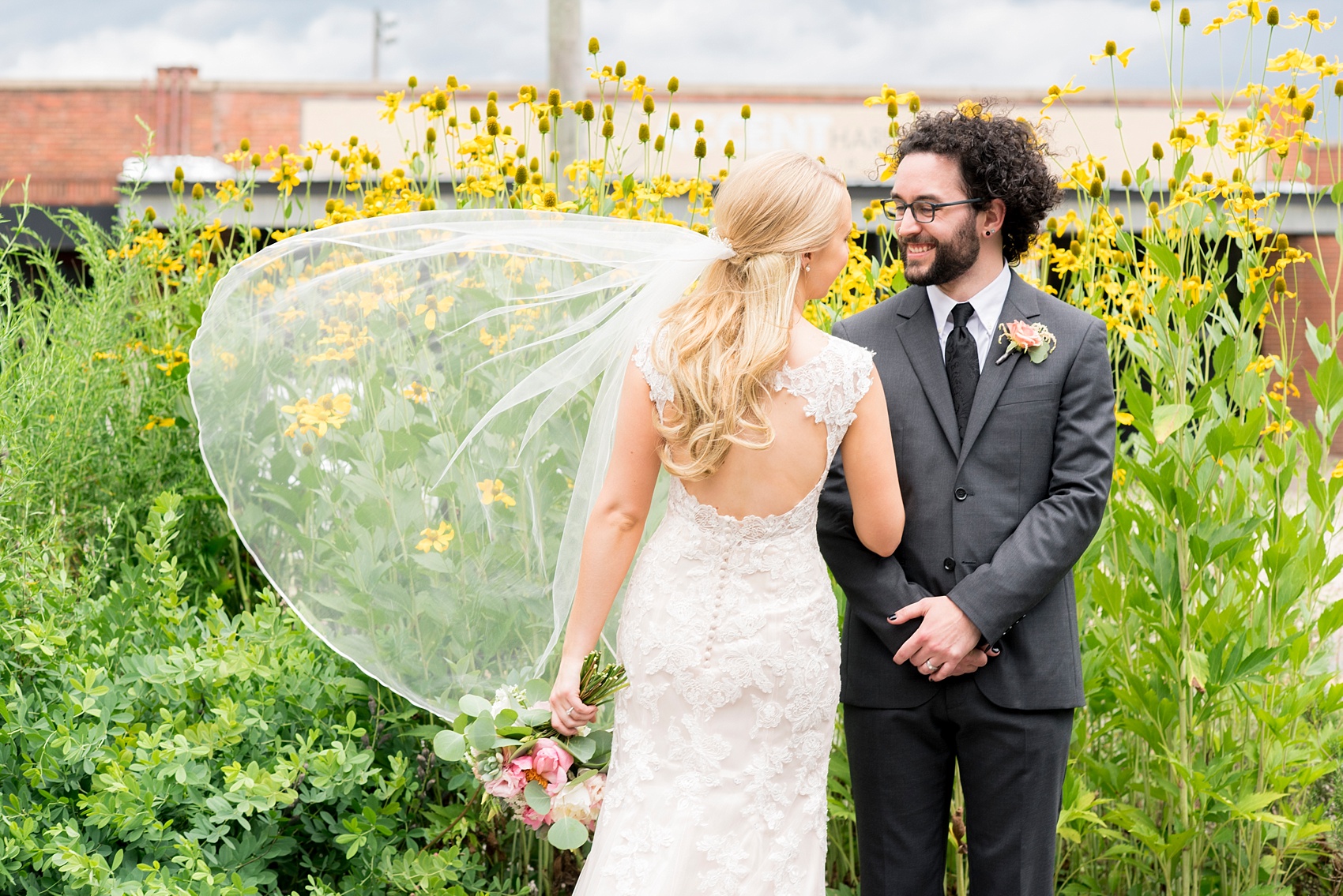 The Rickhouse Durham wedding photos by Mikkel Paige Photography. North Carolina celebration with a photo of the bride and groom downtown.