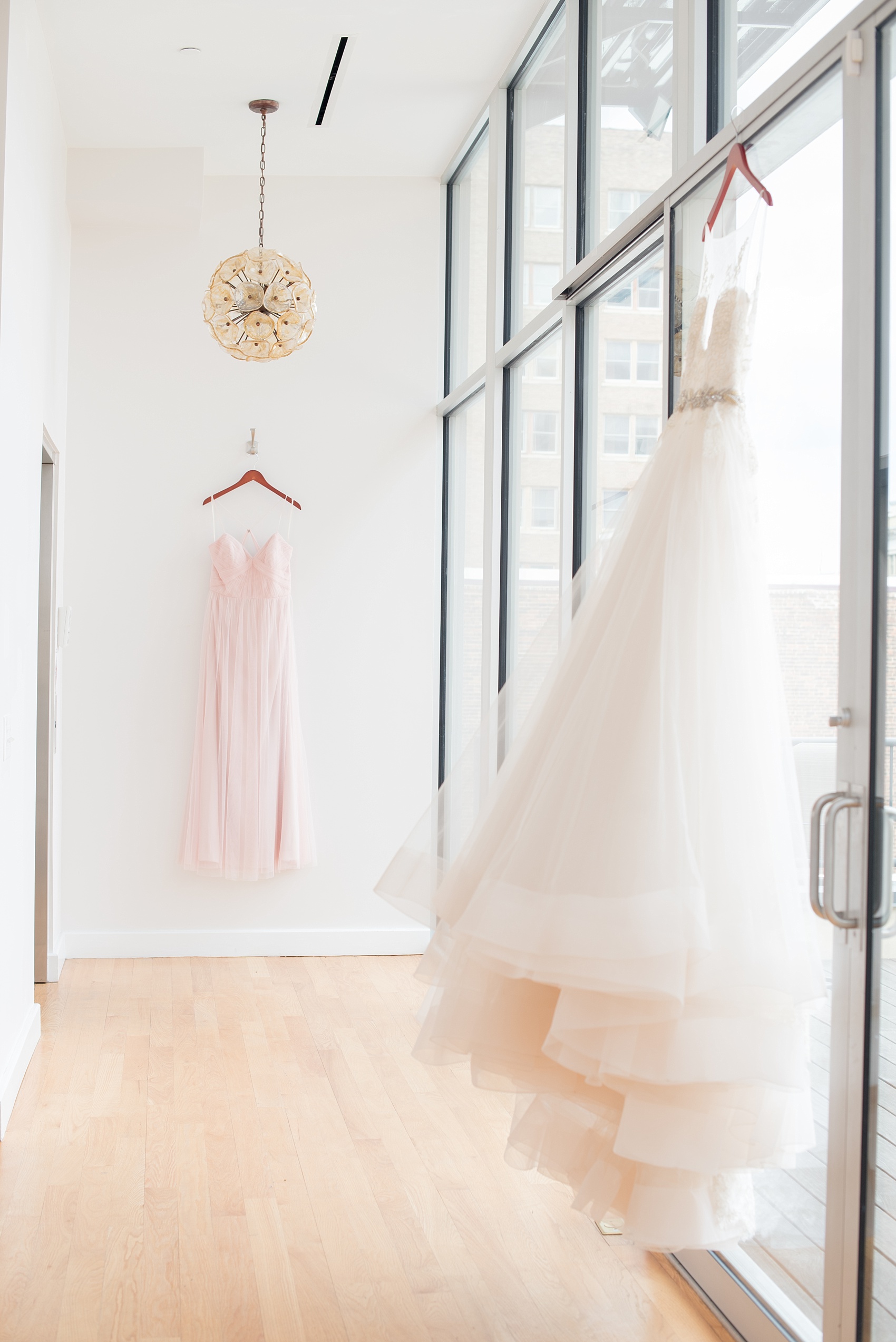 The Glass Box Raleigh wedding photos by Mikkel Paige Photography. Picture of a pink Hayley Paige bridesmaid gown and white wedding dress.