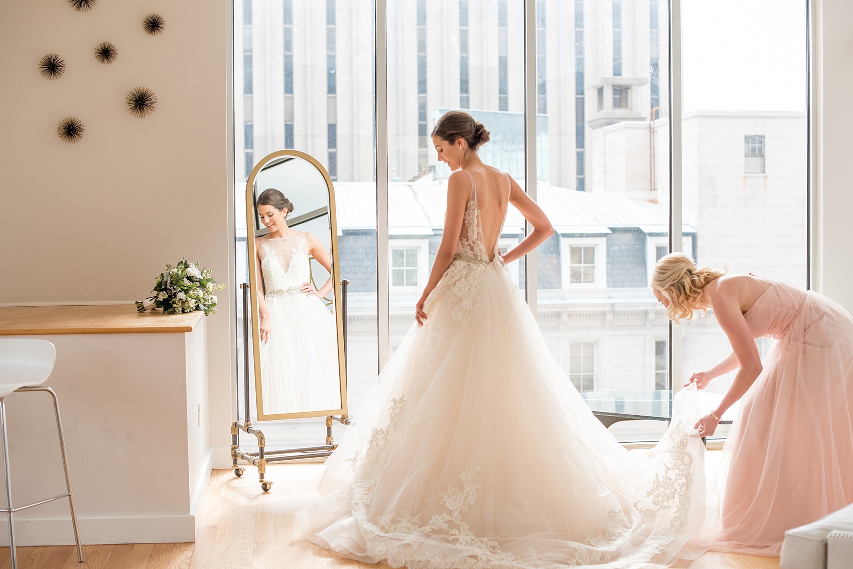 The Glass Box Raleigh wedding photos by Mikkel Paige Photography. Picture of the bride in a Lazaro gown in this modern downtown venue.
