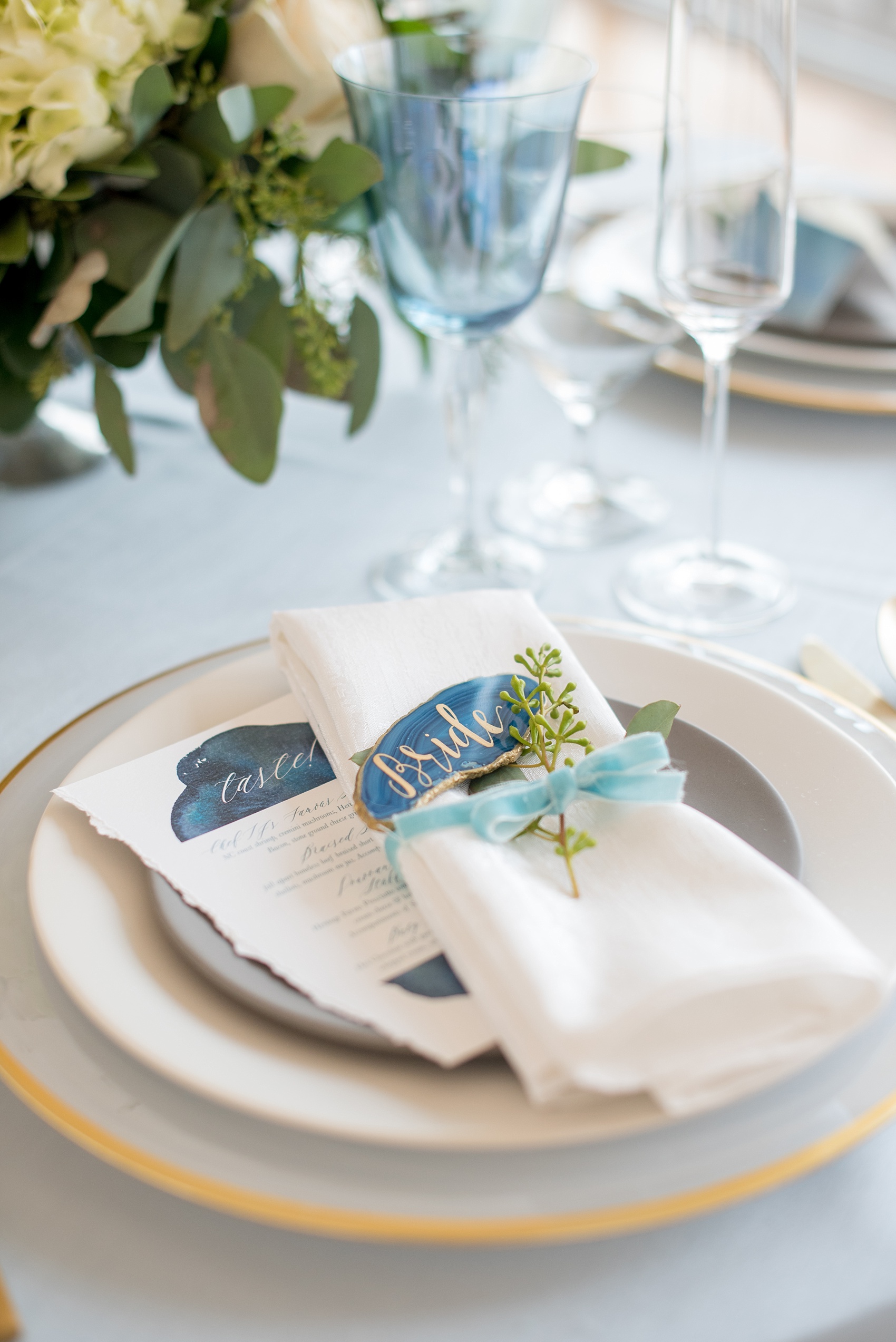 The Glass Box Raleigh wedding photos by Mikkel Paige Photography. Detail picture of the table setting with velvet ribbon and blue agate escort/place cards.