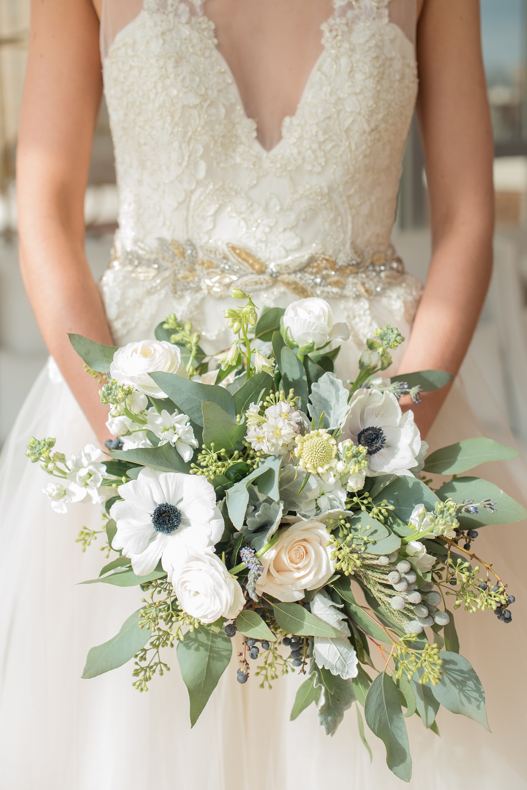 The Glass Box Raleigh wedding photos by Mikkel Paige Photography. Picture of the bride's bouquet of eucalyptus, lavender and anemones.