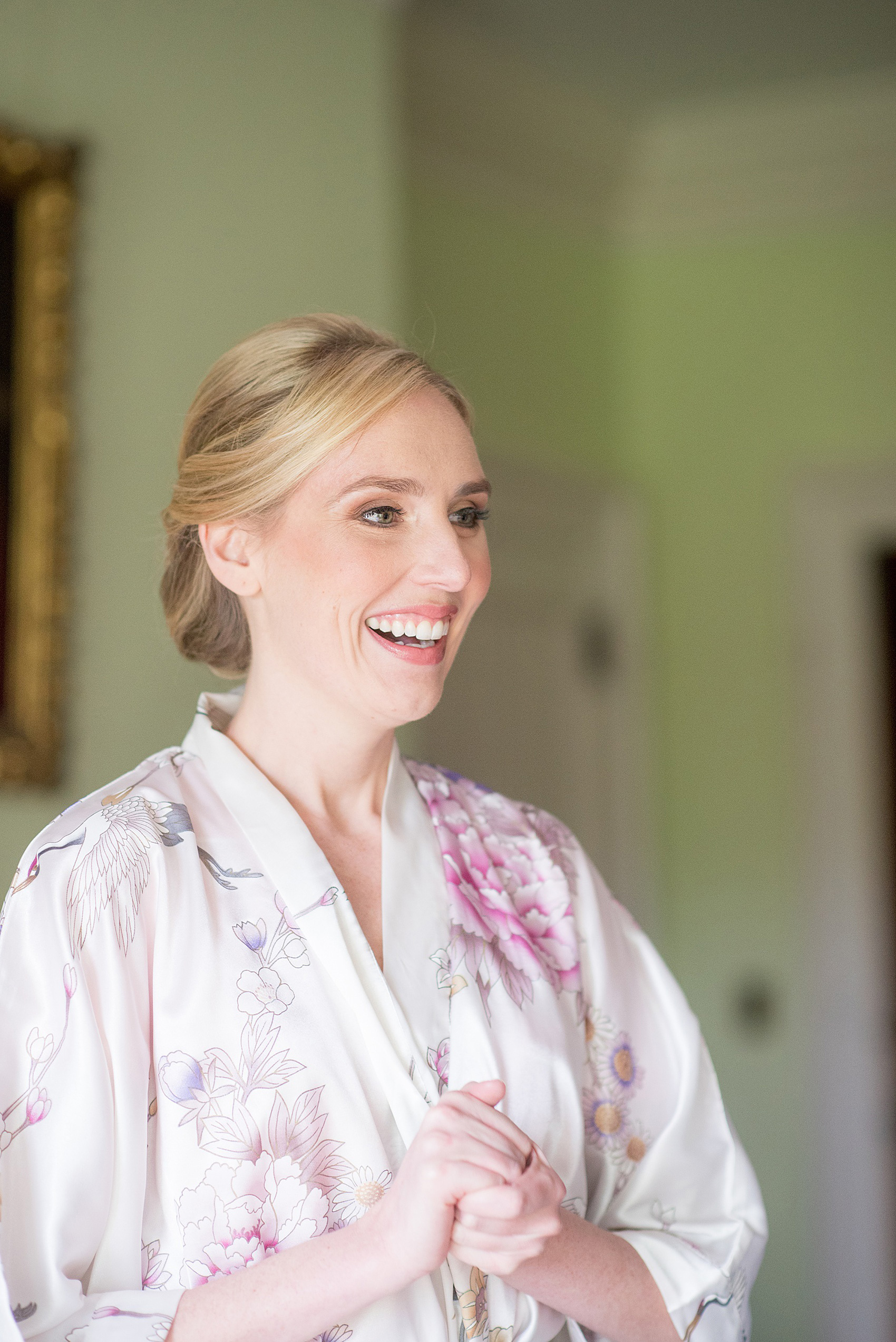 Waveny House wedding photos in Connecticut by Mikkel Paige Photography. Picture of the bride getting ready in a floral robe.