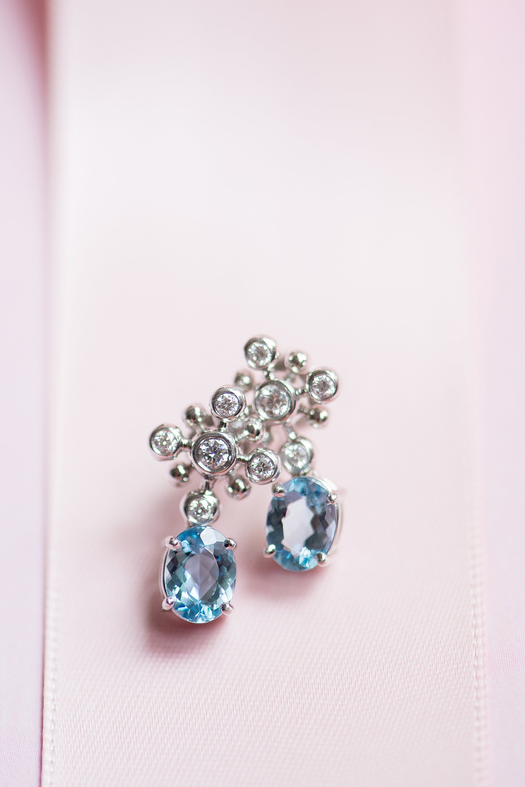 Waveny House wedding photos in Connecticut by Mikkel Paige Photography. Detail picture of the brides diamond and blue topez earrings.