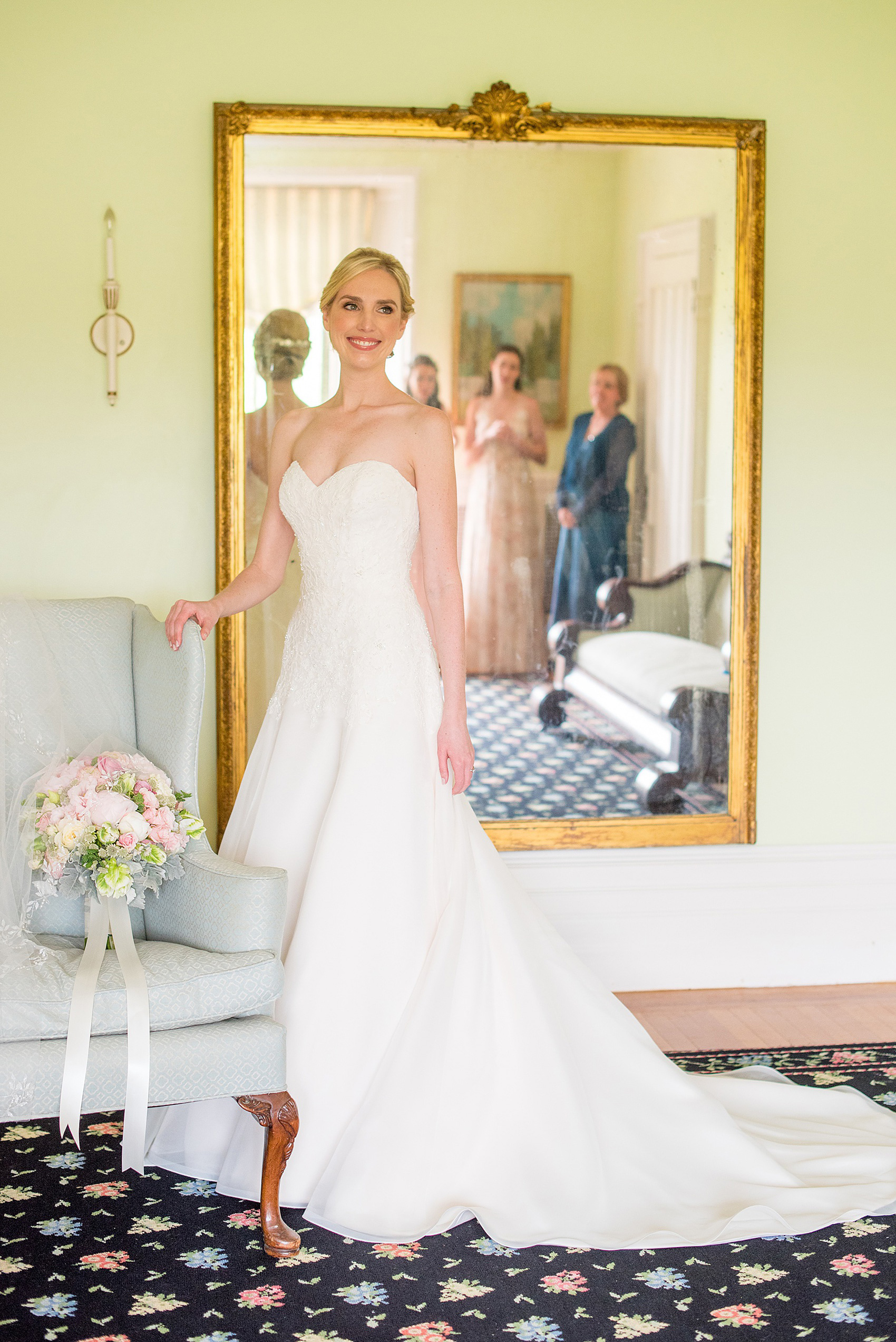 Waveny House wedding photos in Connecticut by Mikkel Paige Photography. Picture of the bride with her family looking on in the mirror.