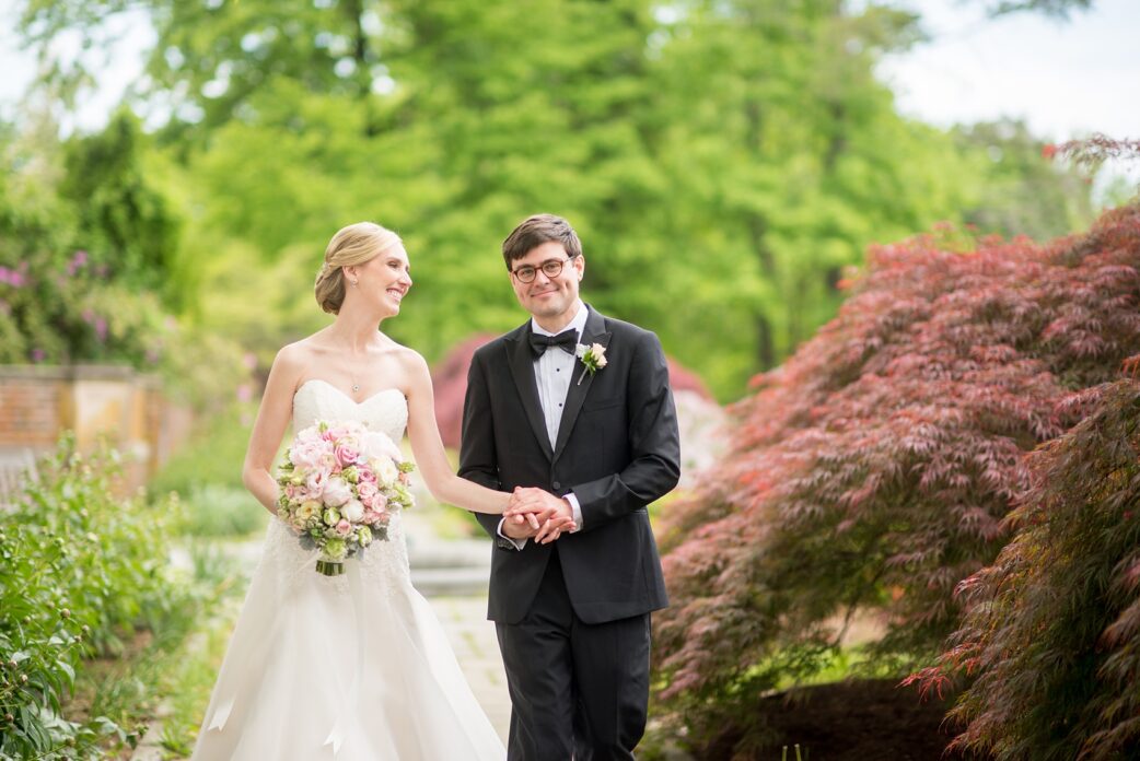 Waveny House wedding photos in Connecticut by Mikkel Paige Photography. Picture of the bride and groom walking in the park.