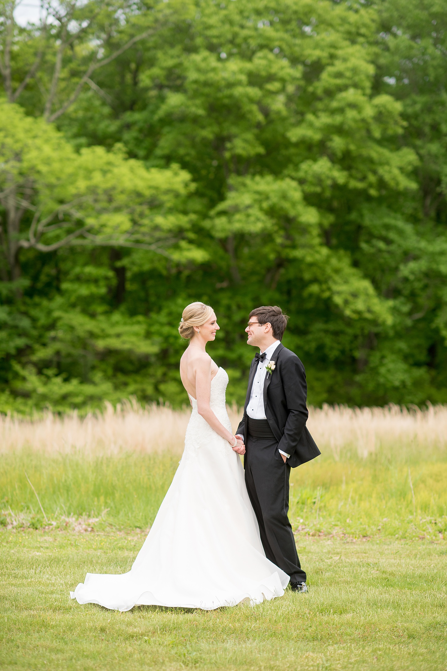 Waveny House wedding photos in Connecticut by Mikkel Paige Photography. Picture of the bride and groom walking in the park.