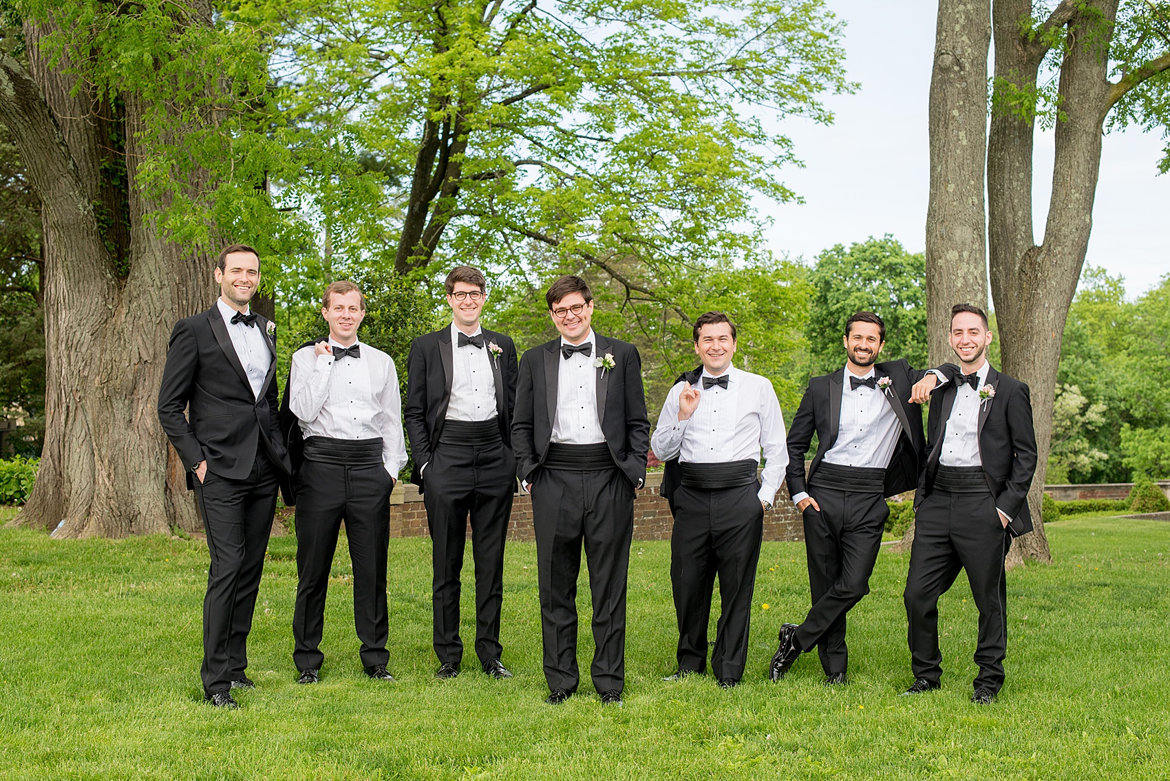 Waveny House wedding photos in Connecticut by Mikkel Paige Photography. Creative picture of the groom and groomsmen in classic black tuxedos. 