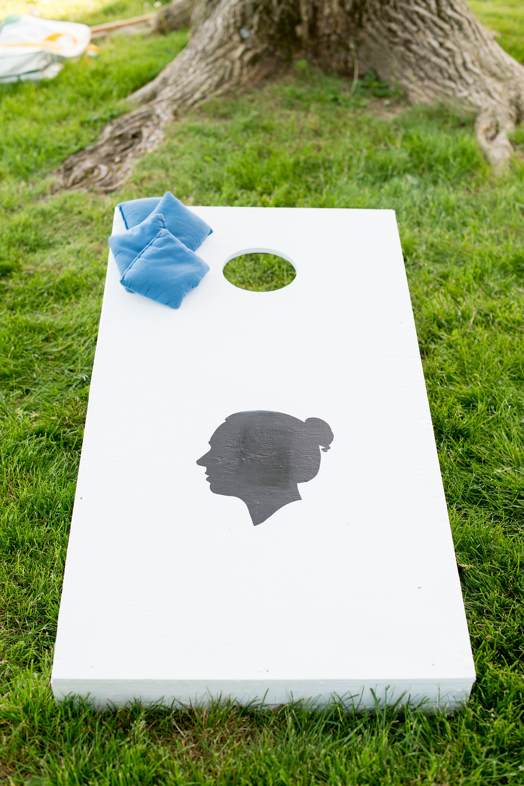 Waveny House wedding photos in Connecticut by Mikkel Paige Photography. Picture of the custom corn hole boards that matched the couple's silhouette save the dates.