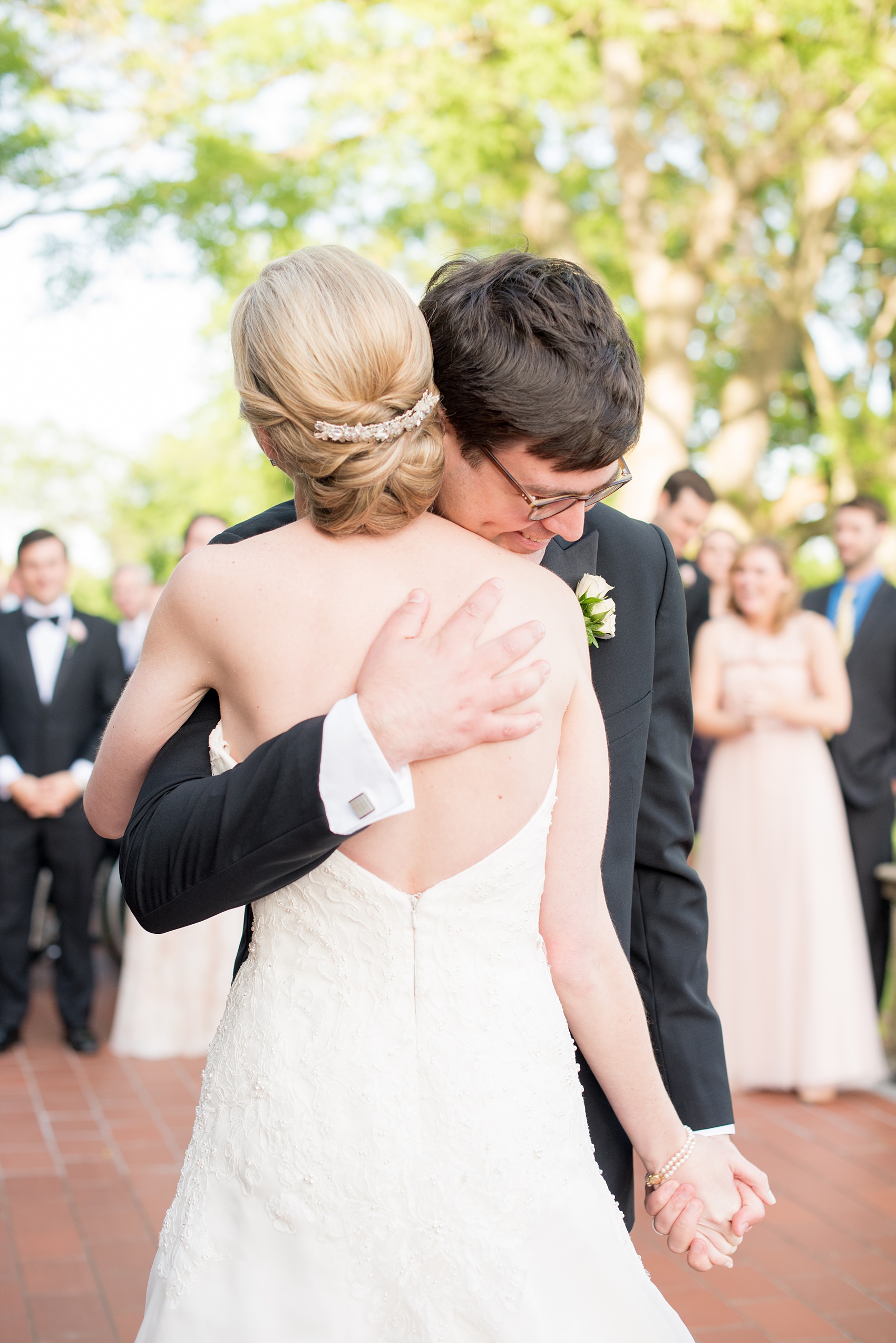 Waveny House wedding photos in Connecticut by Mikkel Paige Photography. Picture of the groom hugging the bride during their first dance.