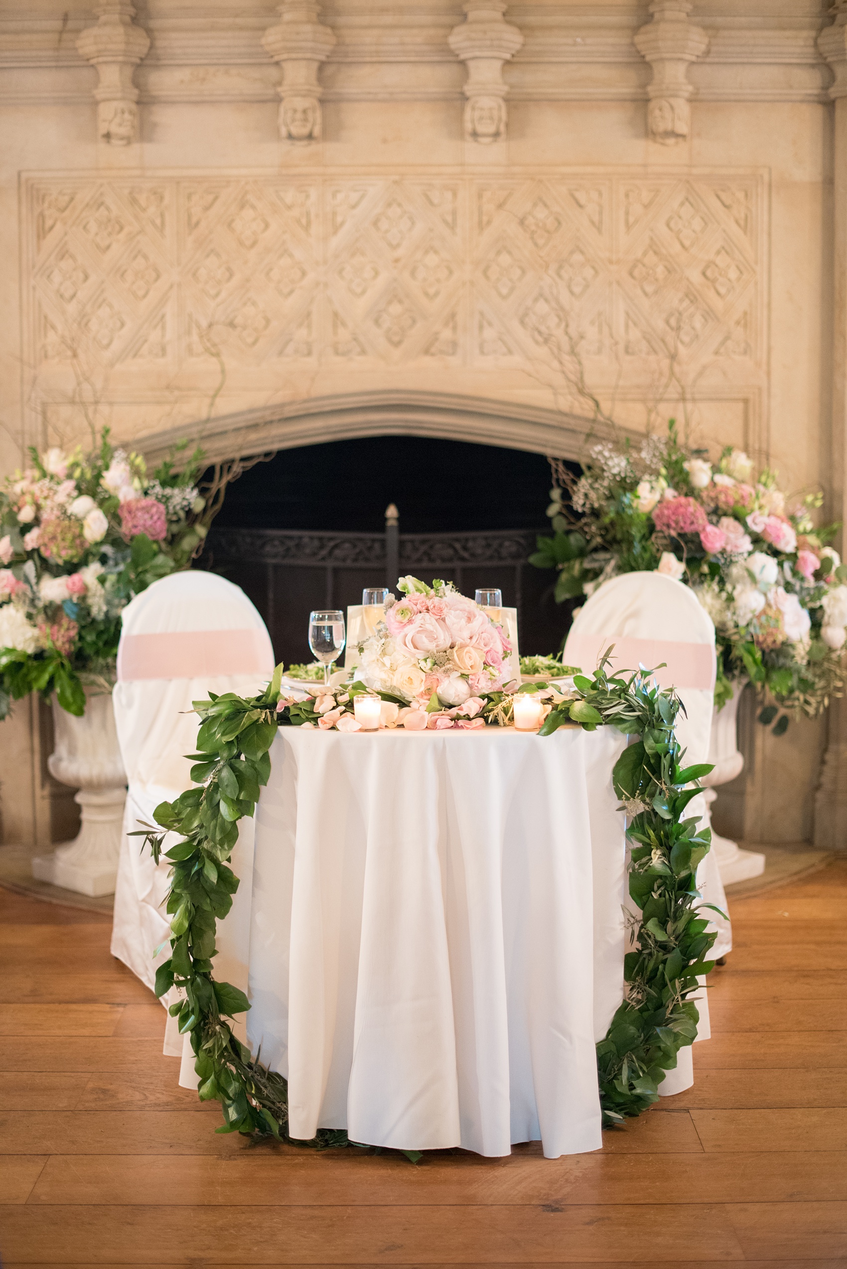 Waveny House wedding photos in Connecticut by Mikkel Paige Photography. Picture of the sweetheart table with greenery garland. 