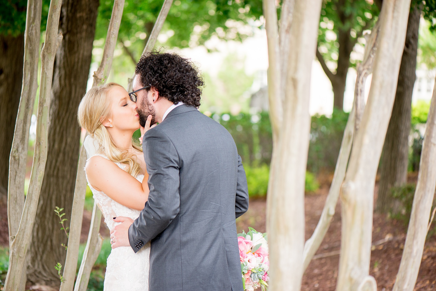 Mikkel Paige Photography images from a wedding in Durham, North Carolina at The Rickhouse. Image of the bride and groom kissing.