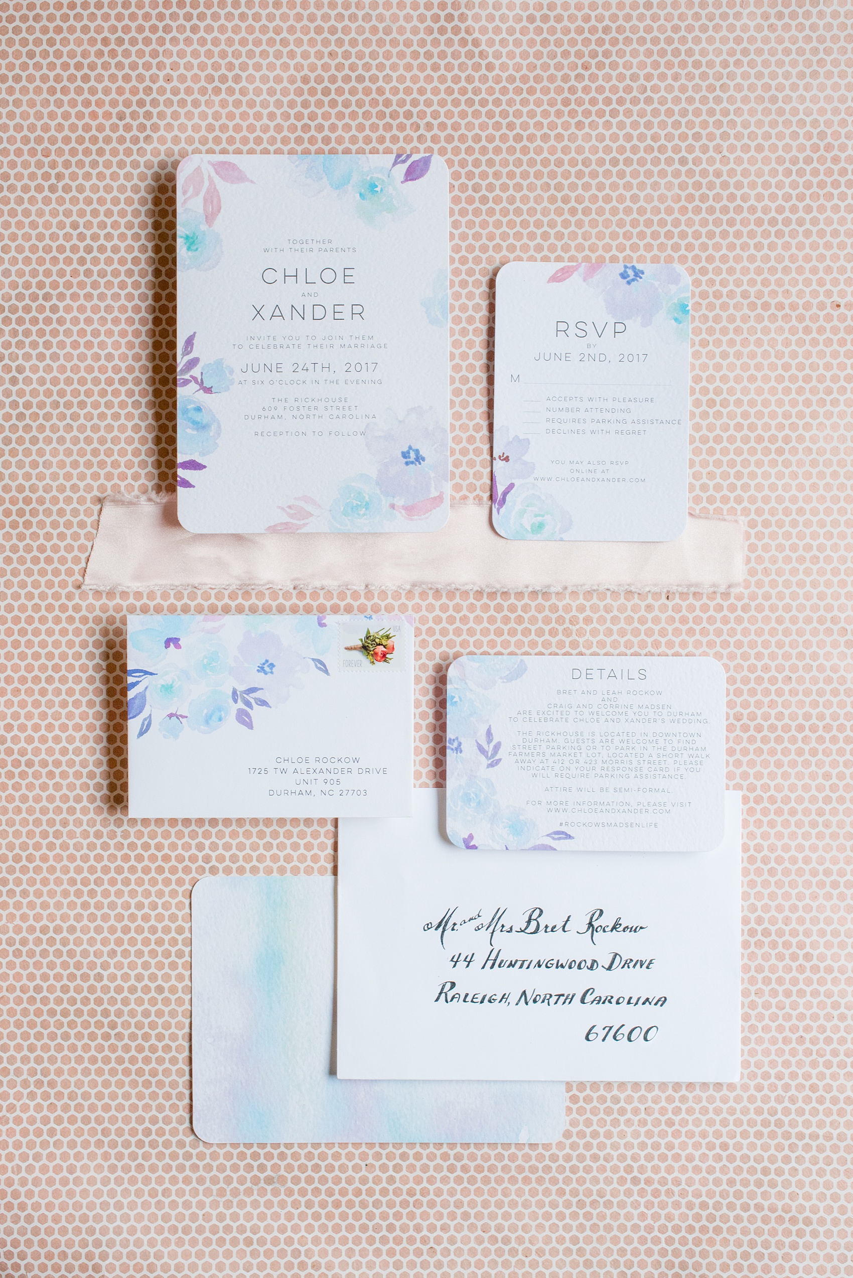 Mikkel Paige Photography photos from a wedding in Durham, North Carolina at The Rickhouse. Detail image of the watercolor wedding invitation from Wedding Paper Divas in blue and purple.