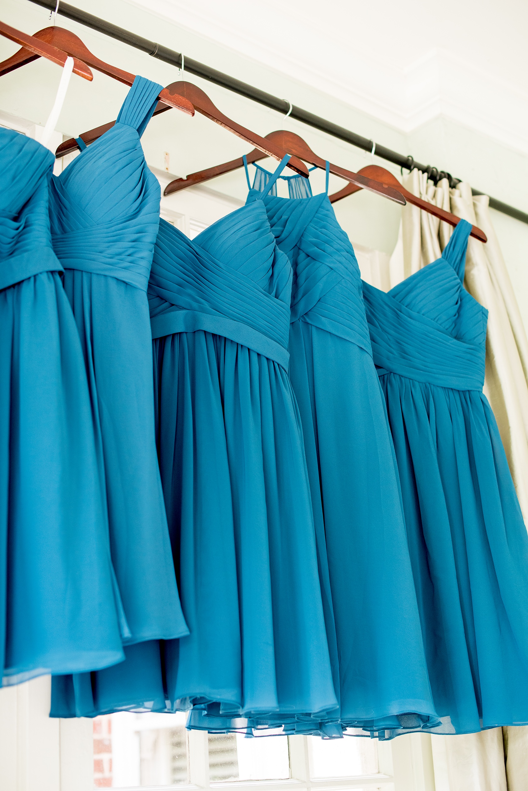 Mikkel Paige Photography photos from a wedding in Durham, North Carolina. Picture of the bridesmaids teal dresses.