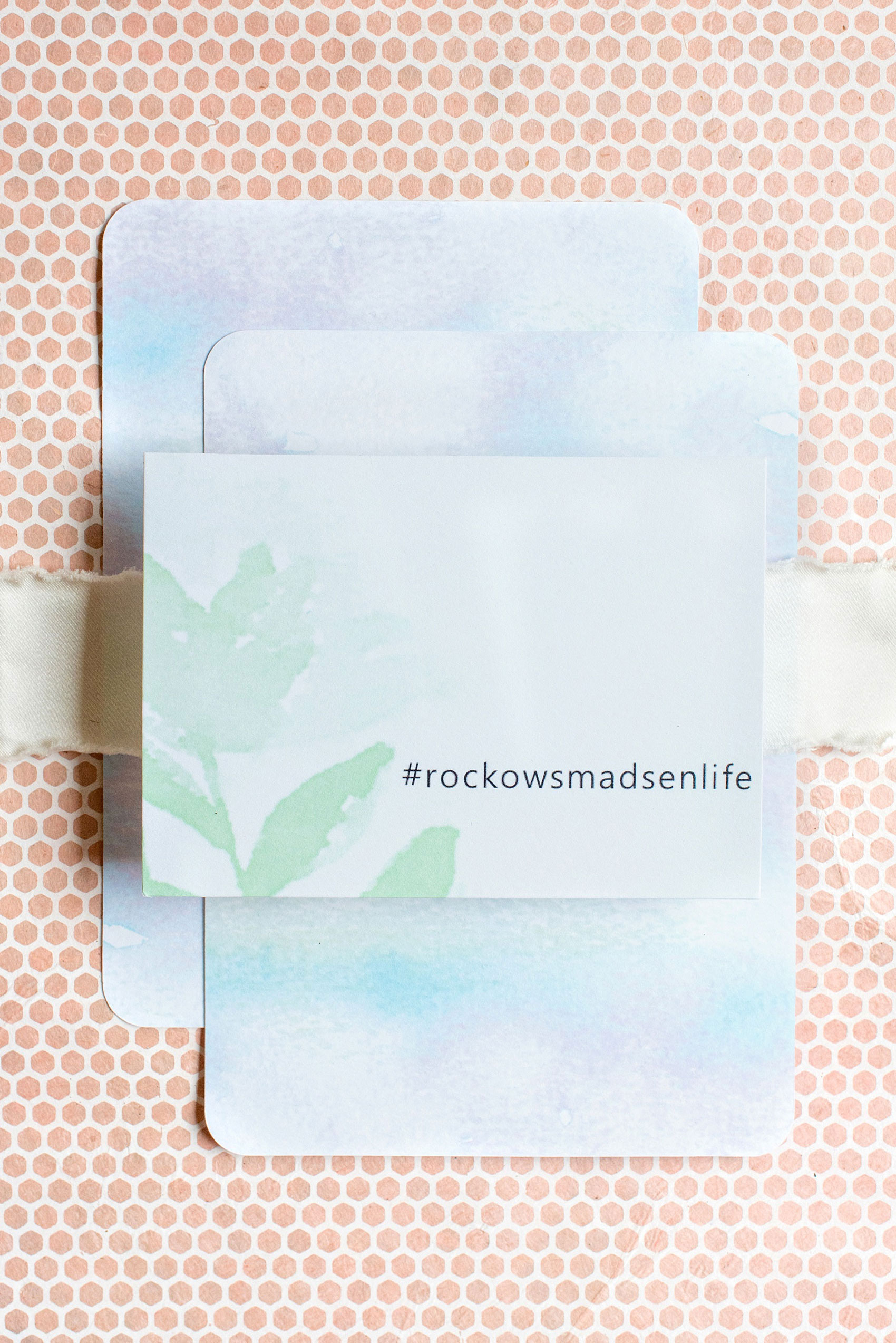 Mikkel Paige Photography photos from a wedding in Durham, North Carolina at The Rickhouse. Detail image of the watercolor wedding invitation hashtag card from Wedding Paper Divas. 