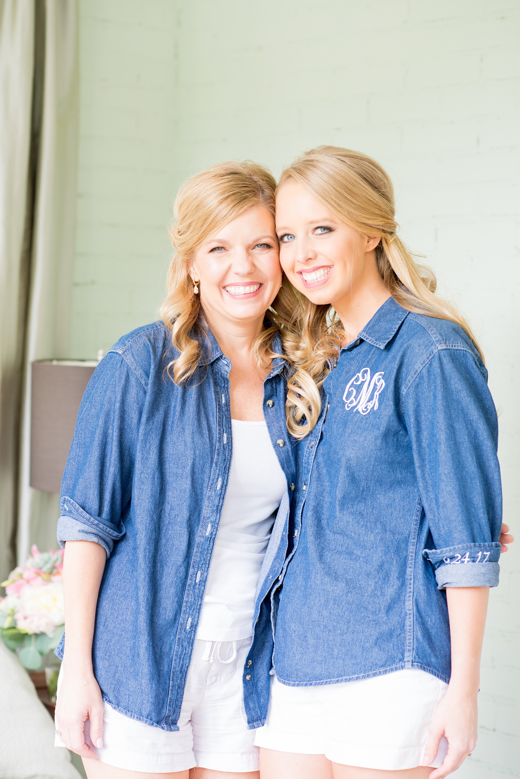 Mikkel Paige Photography photos from a wedding in Durham, North Carolina. Picture of the bride and her mom in custom monogrammed denim shirts with date on the sleeve at King's Daughters Inn.