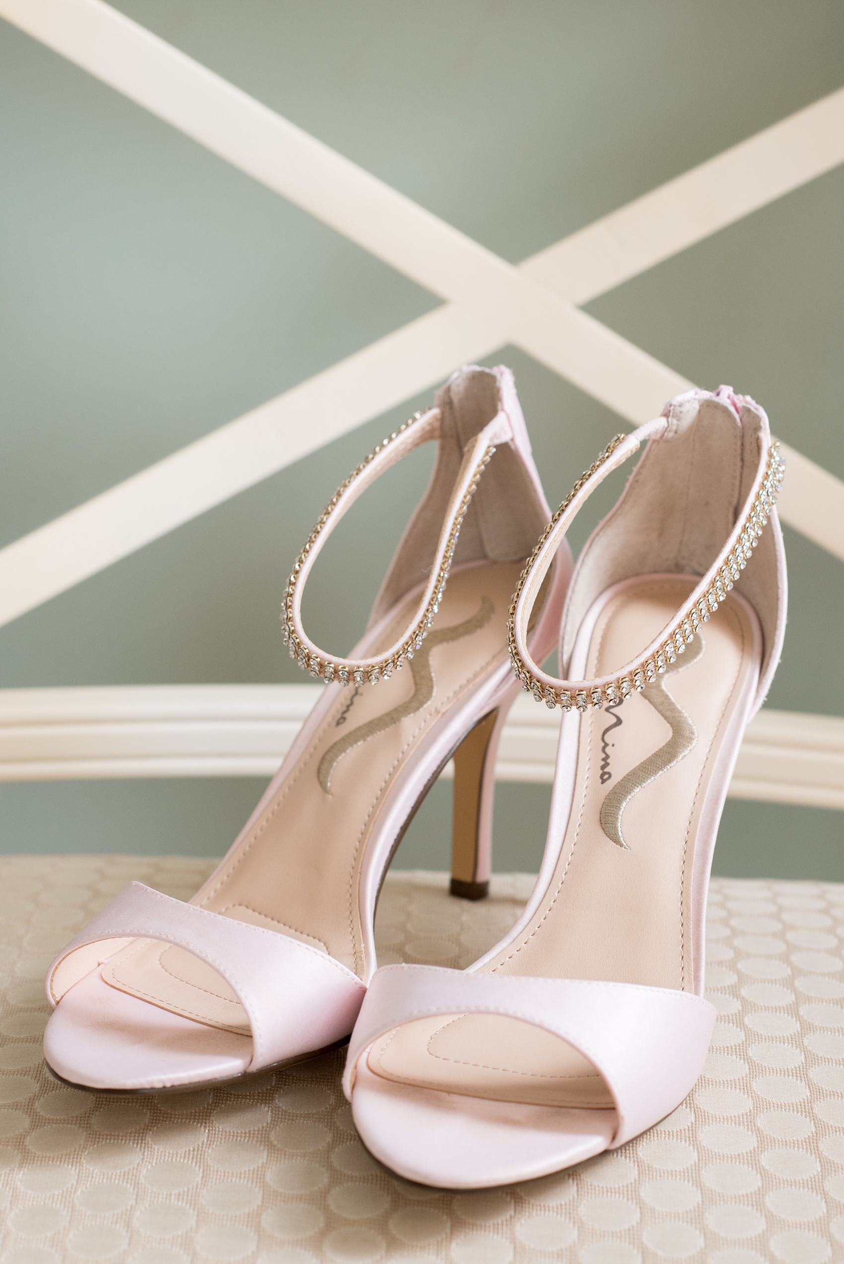 Mikkel Paige Photography photos from getting ready photos at King's Daughter's Inn, Durham, North Carolina. Detail picture of the bride's pink and rhinestone ankle shoes.