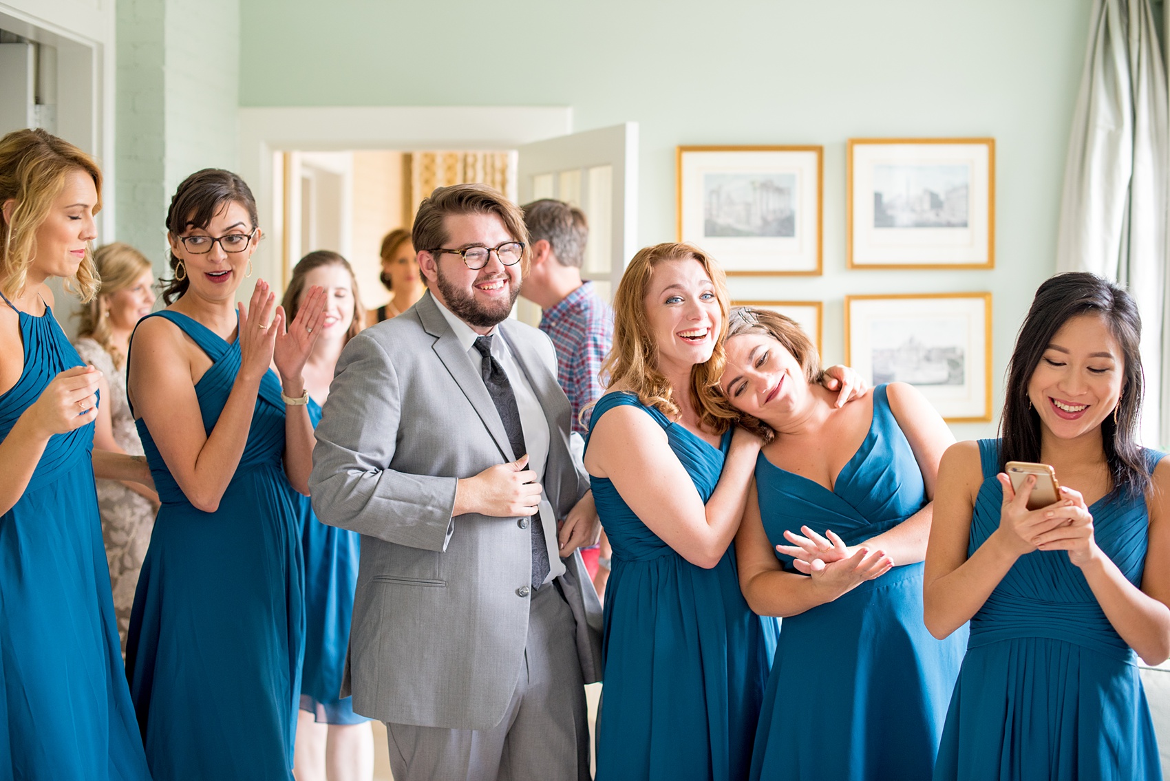 Mikkel Paige Photography photos from a wedding in Durham, North Carolina. Picture of the bridal party's first look with the bride at King's Daughters Inn.