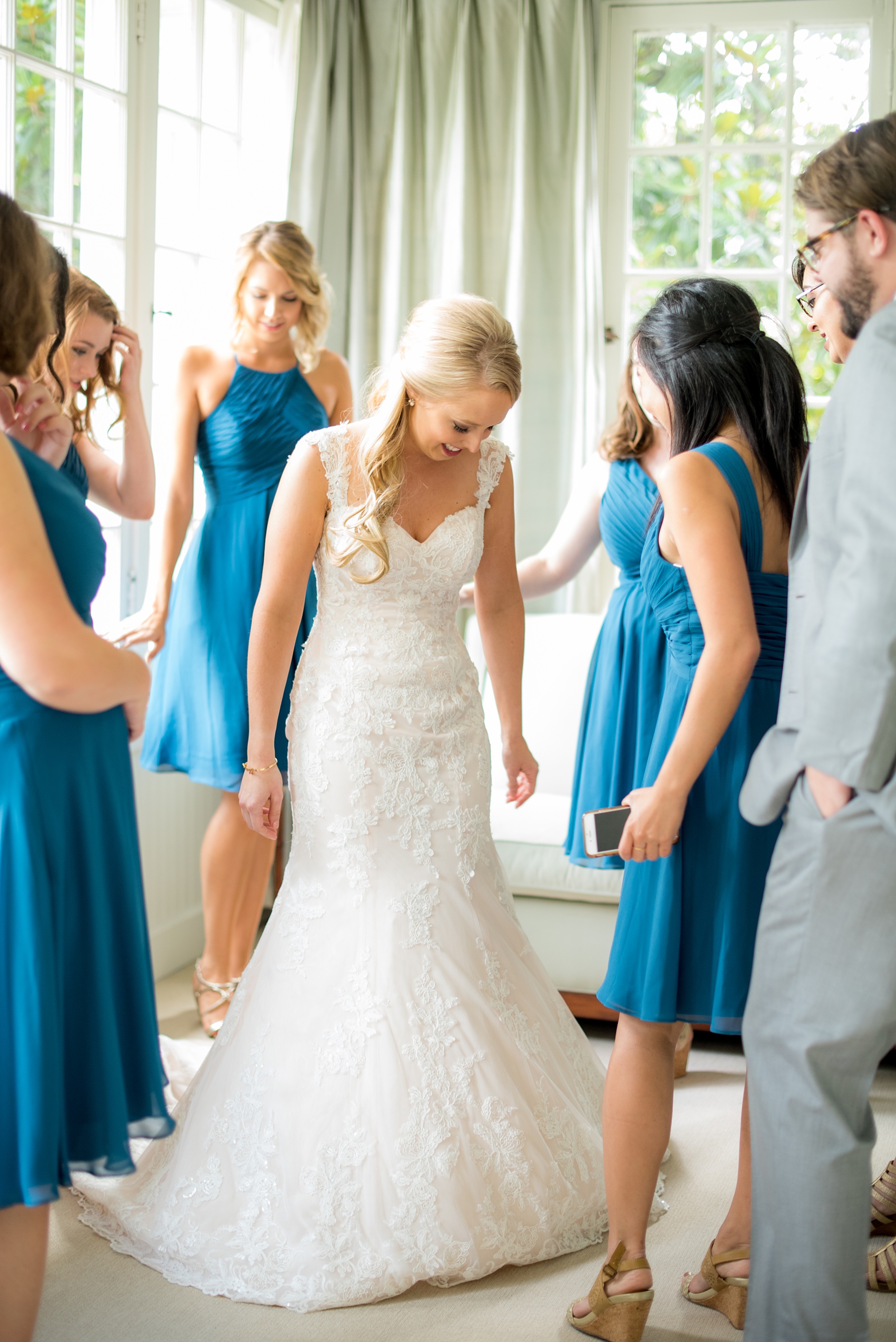 Mikkel Paige Photography photos from a wedding in Durham, North Carolina. Picture of the bridal party's first look with the bride at King's Daughters Inn.