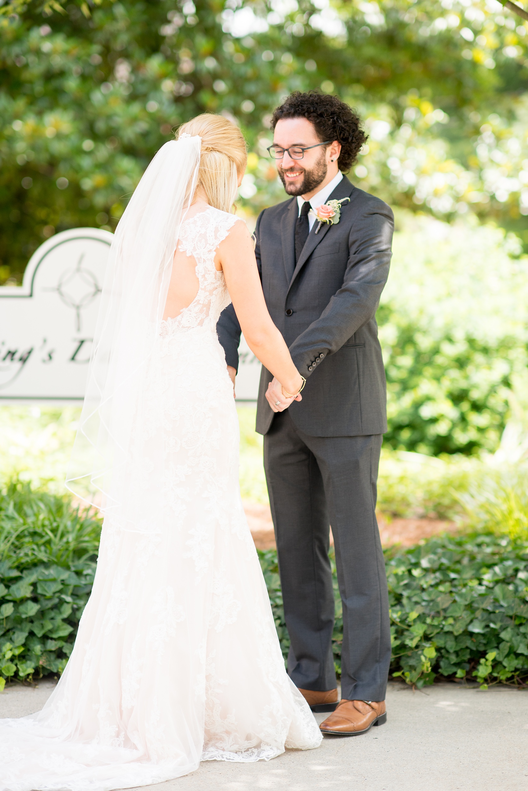 Mikkel Paige Photography photos from a wedding in Durham, North Carolina. Picture of the bride and groom after their first look at the King's Daughters Inn.