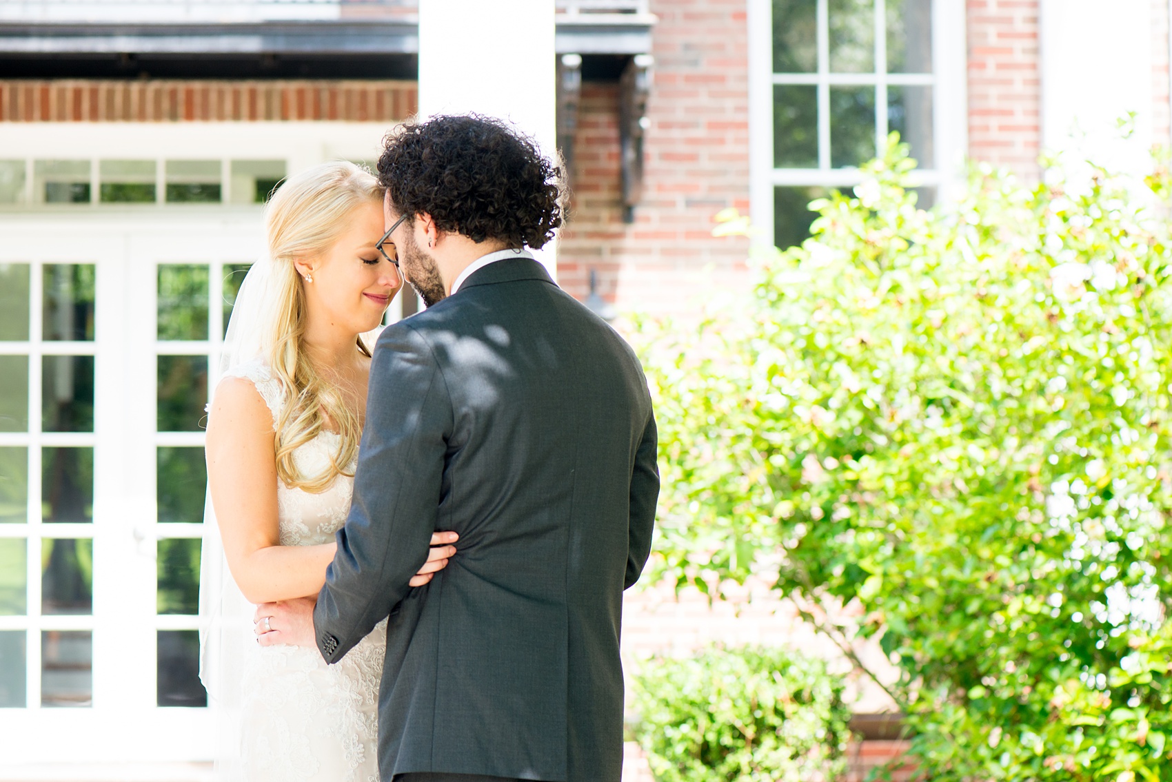 Mikkel Paige Photography photos from a wedding in Durham, North Carolina. Picture of the bride and groom after their first look at the King's Daughters Inn.