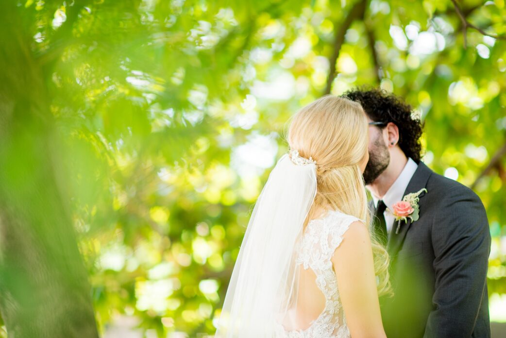 Mikkel Paige Photography photos from a wedding in Durham, North Carolina. Picture of the bride and groom after their first look at the King's Daughters Inn.