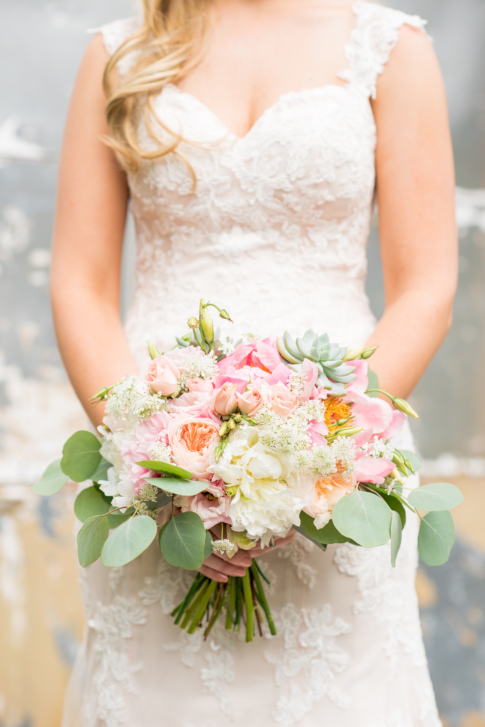 Mikkel Paige Photography photos from a wedding in Durham, North Carolina. Picture of the bride's bouquet of peonies, succulents and eucalyptus by Teacup Floral.