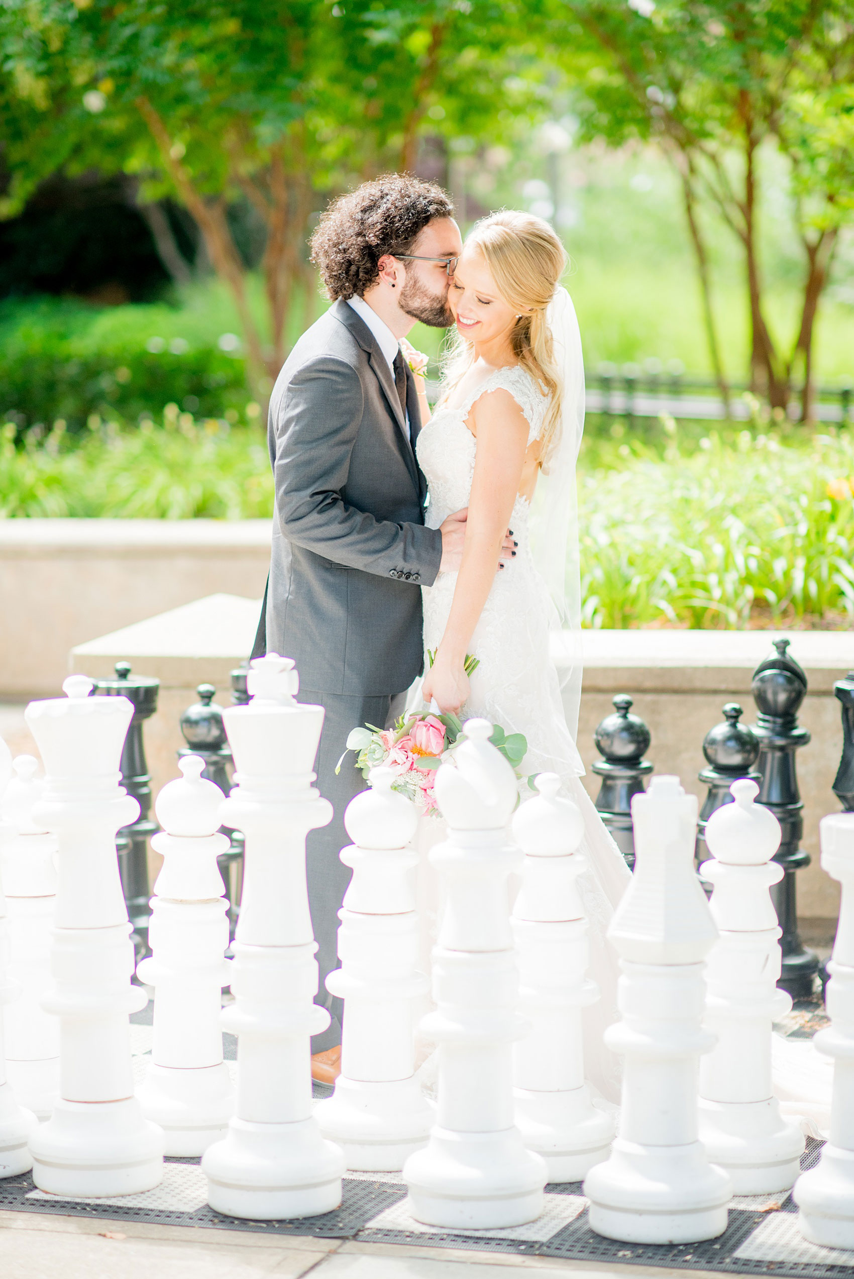 Mikkel Paige Photography photos from a wedding in Durham, North Carolina. Picture of the bride and groom on a giant chess board.