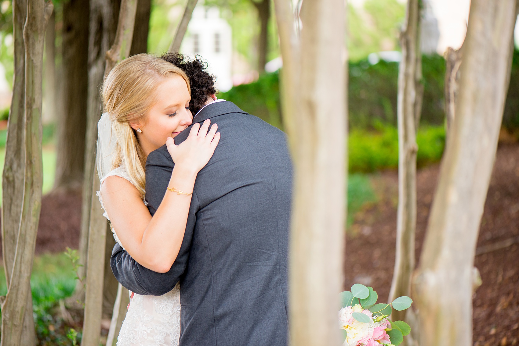 Mikkel Paige Photography photos from a wedding in Durham, North Carolina. Picture of the bride and groom hugging.