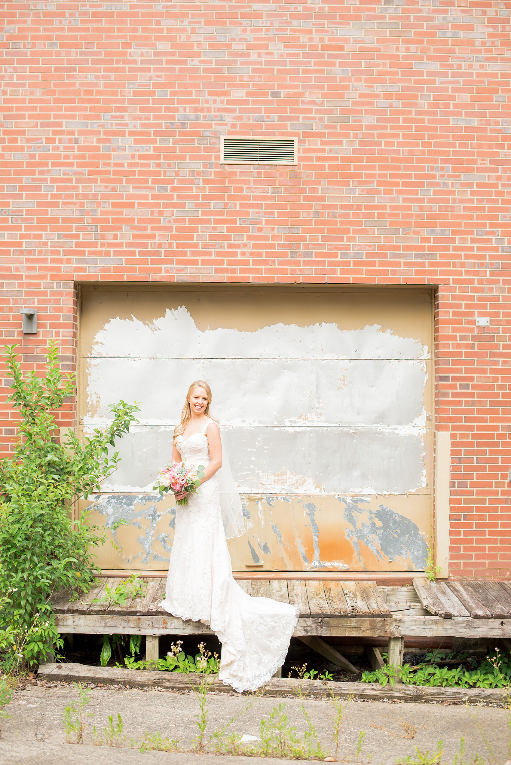 Mikkel Paige Photography photos from a wedding in Durham, North Carolina. Picture of the bride in an urban, rustic setting.
