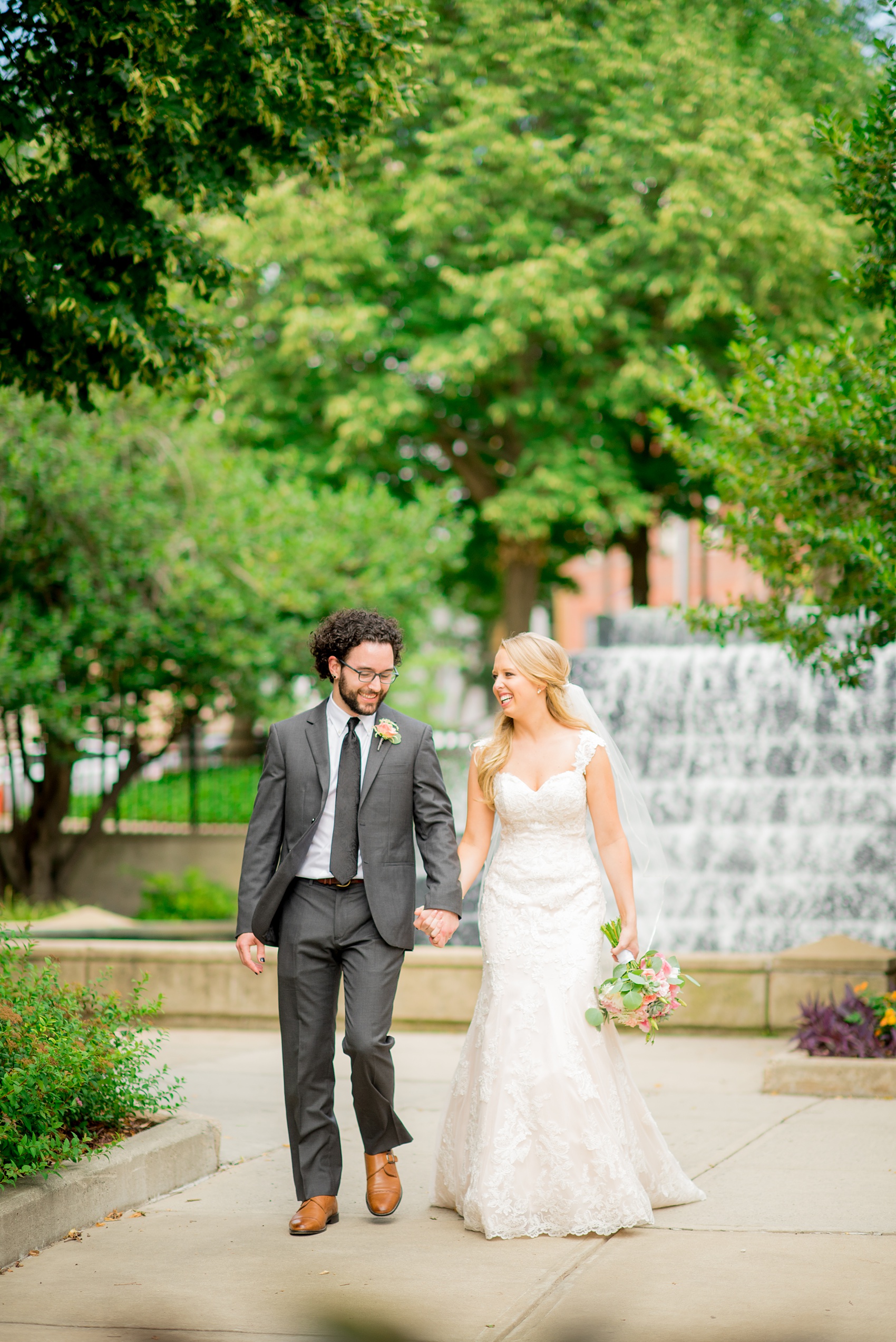 Mikkel Paige Photography photos from a wedding in Durham, North Carolina. Picture of the bride and groom walking downtown.