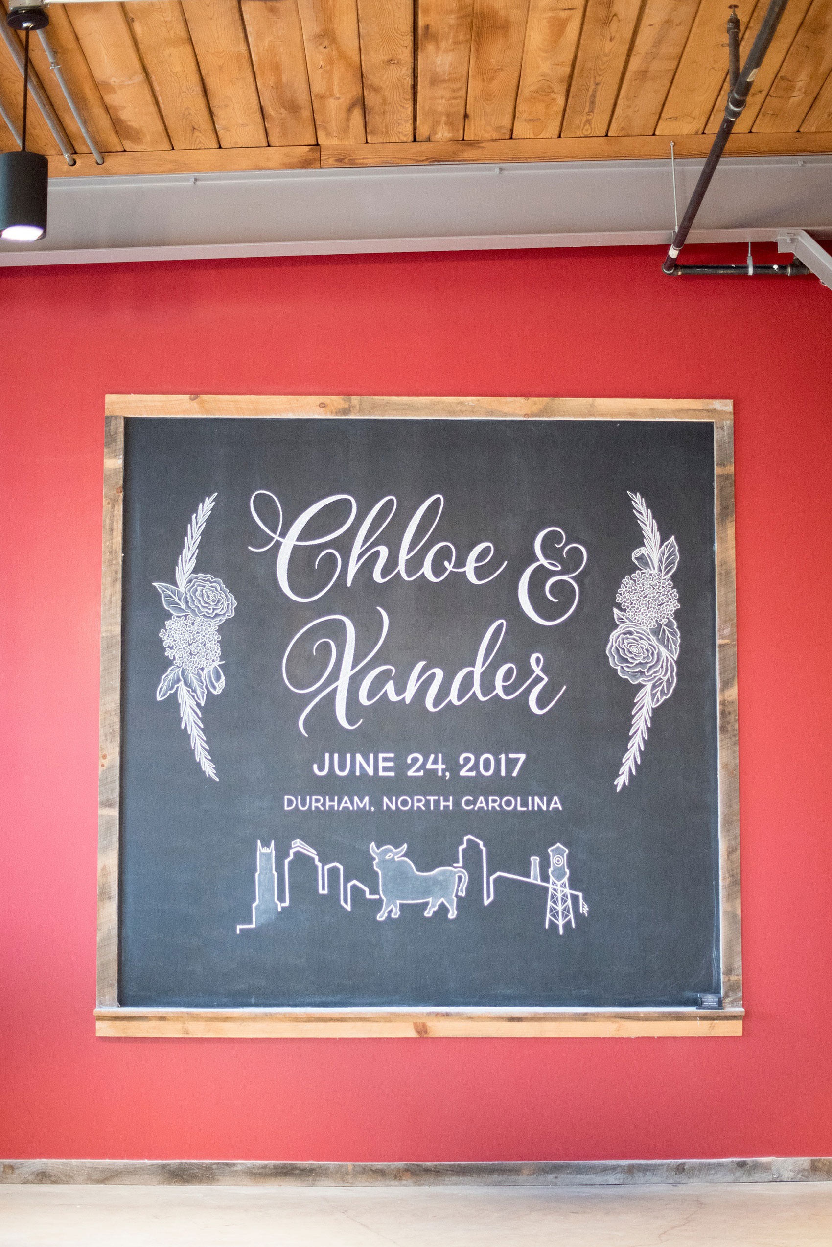 Mikkel Paige Photography photos from a wedding at The Rickhouse in Durham, North Carolina. Picture of the custom chalkboard design.