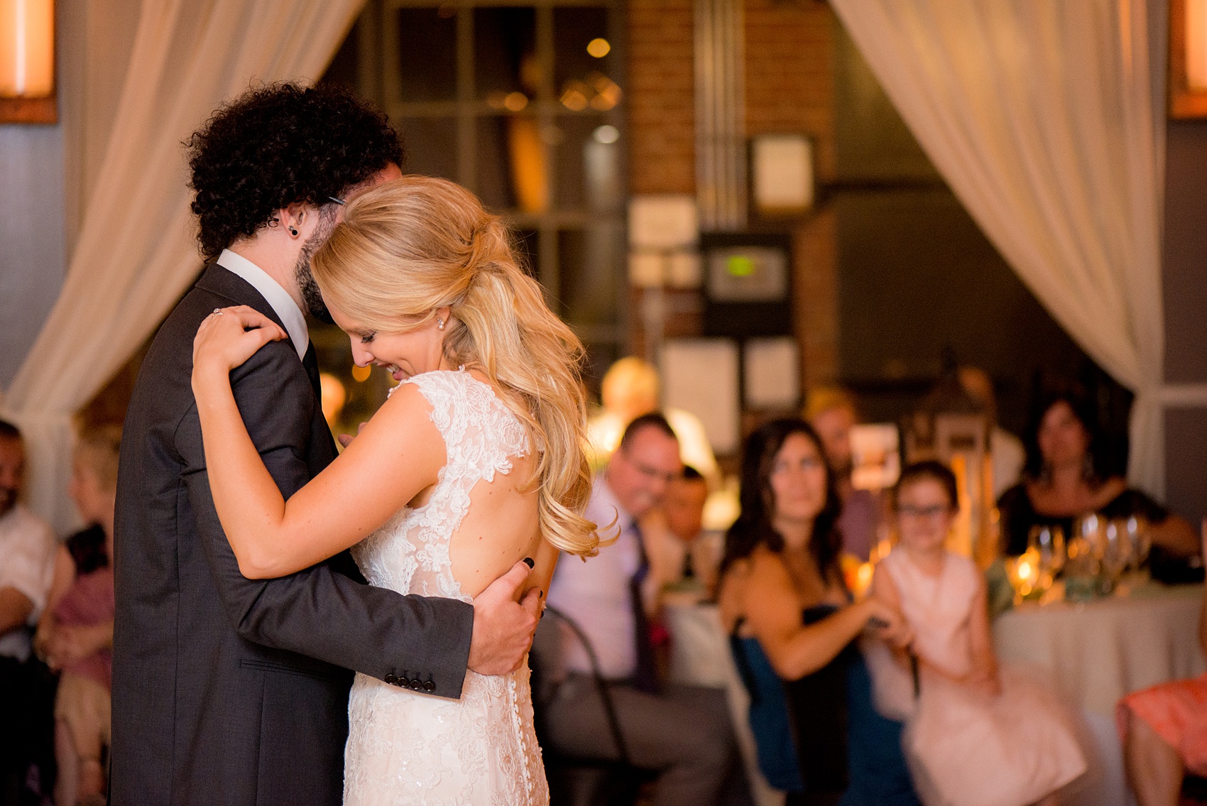 Mikkel Paige Photography photos from a wedding at The Rickhouse in Durham, North Carolina. Picture of the bride and groom's first dance.a