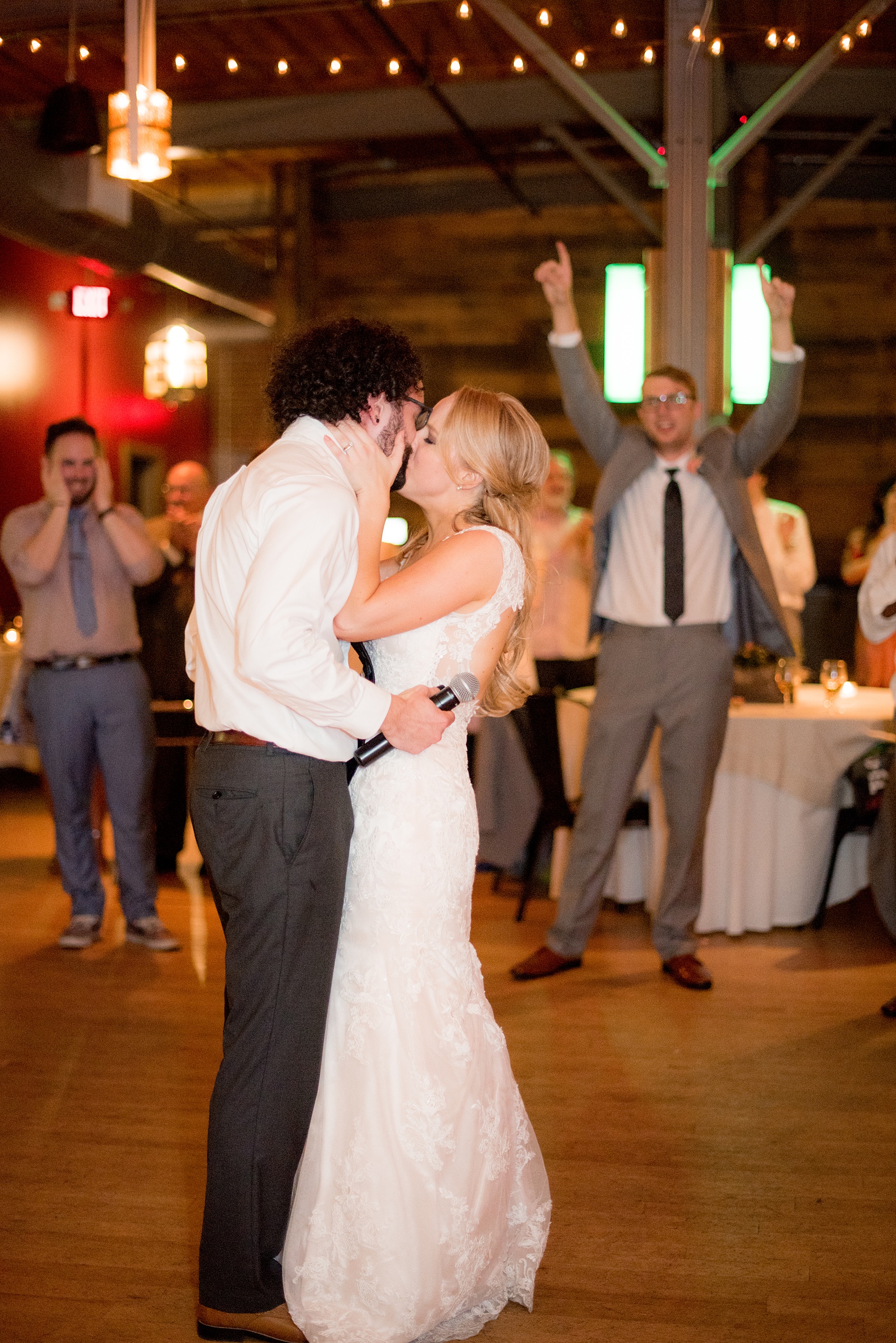 Mikkel Paige Photography photos from a wedding at The Rickhouse in Durham, North Carolina. Picture of the bride kissing her groom after he dedicated a song to her!