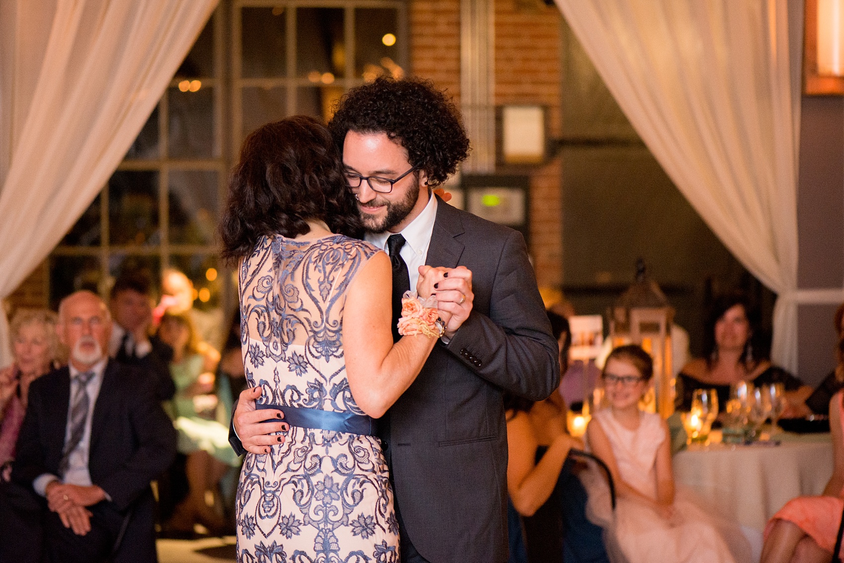 Mikkel Paige Photography photos from a wedding at The Rickhouse in Durham, North Carolina. Picture of the groom's dance with his mother.