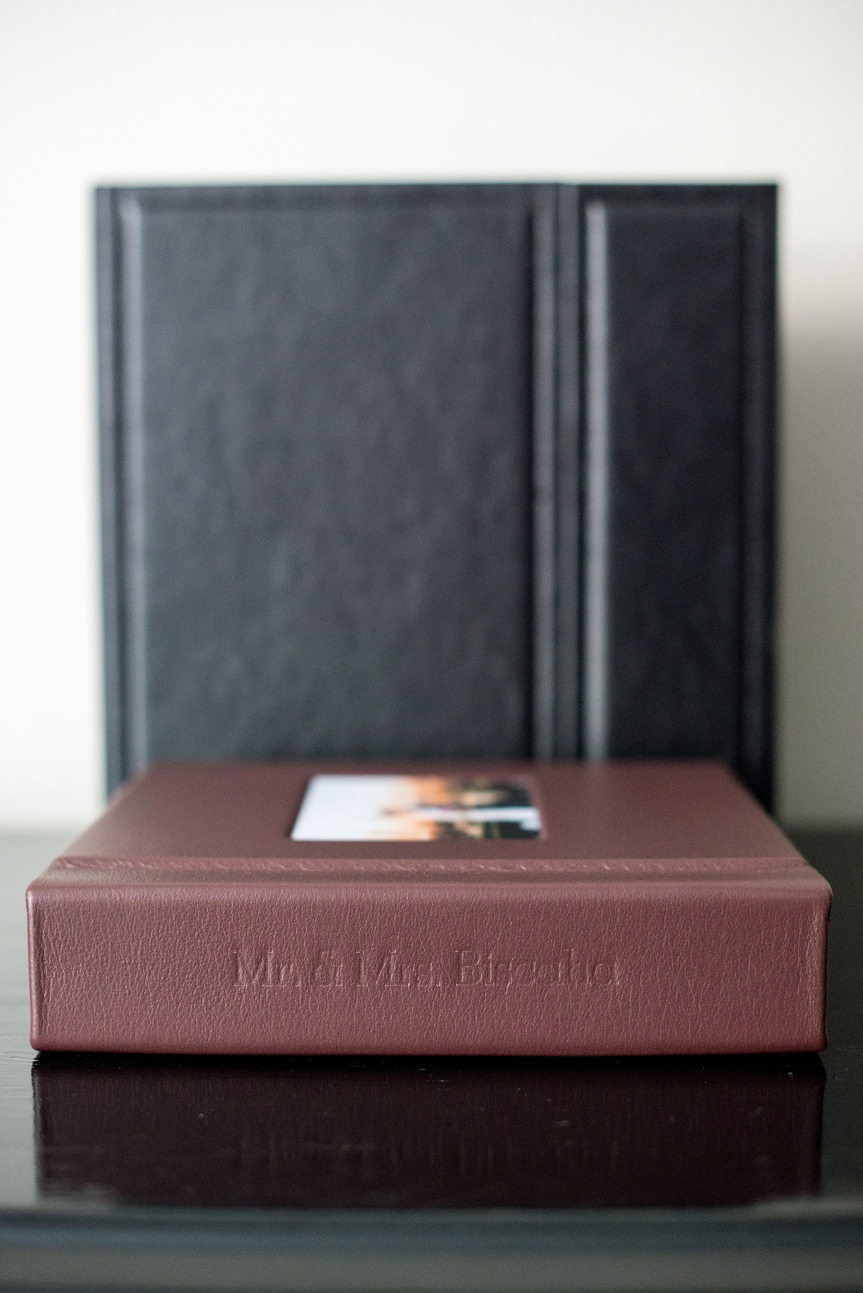 Mikkel Paige Photography photos of a fine art leather Madera wedding album in Oxblood. 8x8" Parent album with inset cover photo and spine debossing.