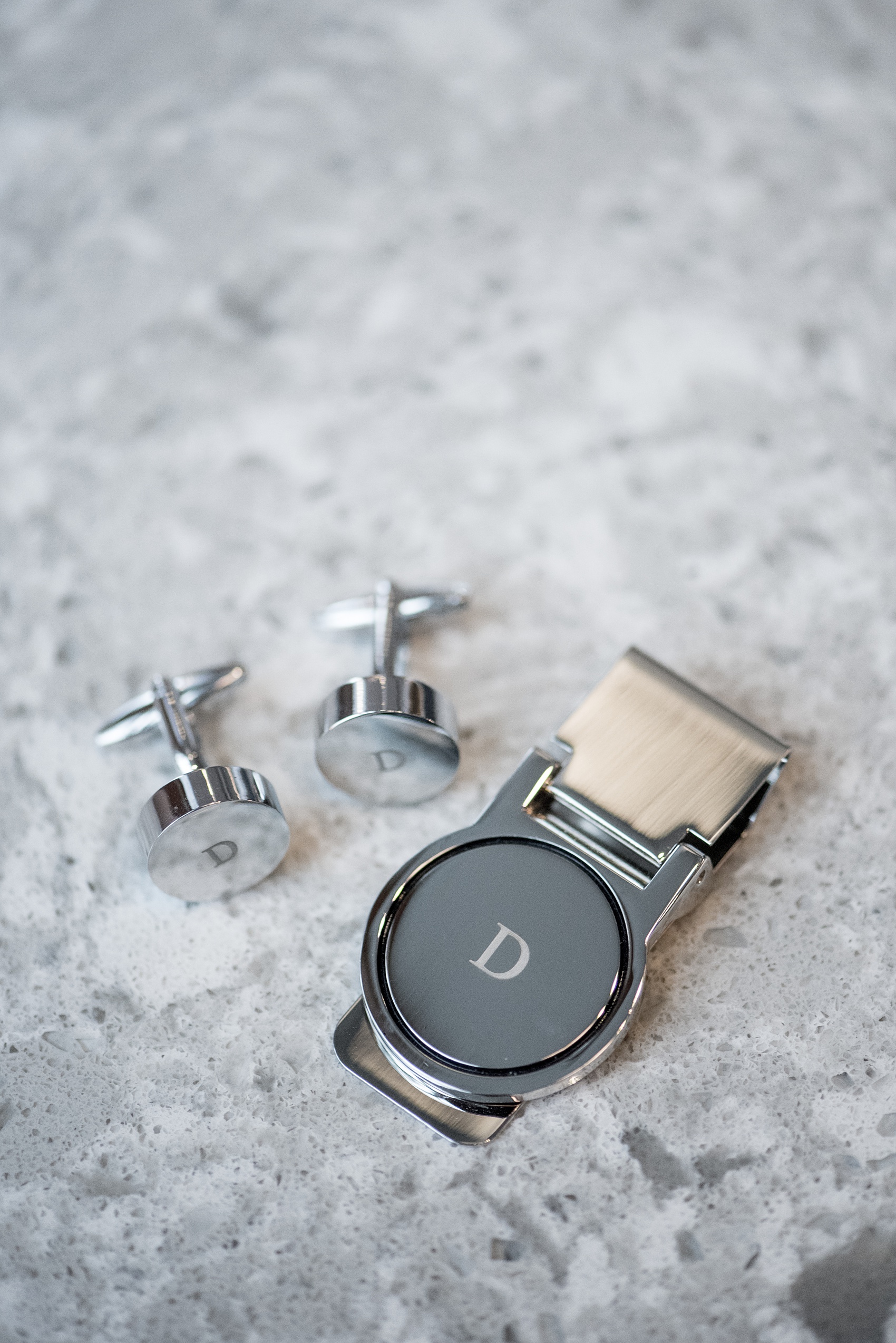 Mikkel Paige Photography pictures of a Westbury Manor wedding on Long Island. Detail photo the groom's custom monogram cufflinks and money clip.