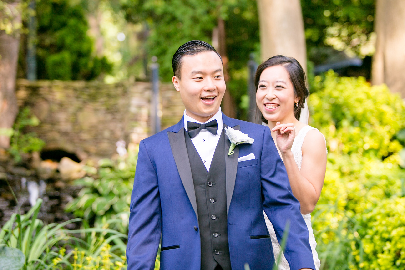 Mikkel Paige Photography pictures of a Westbury Manor wedding on Long Island. Photo of the bride and groom's first look in the gardens.