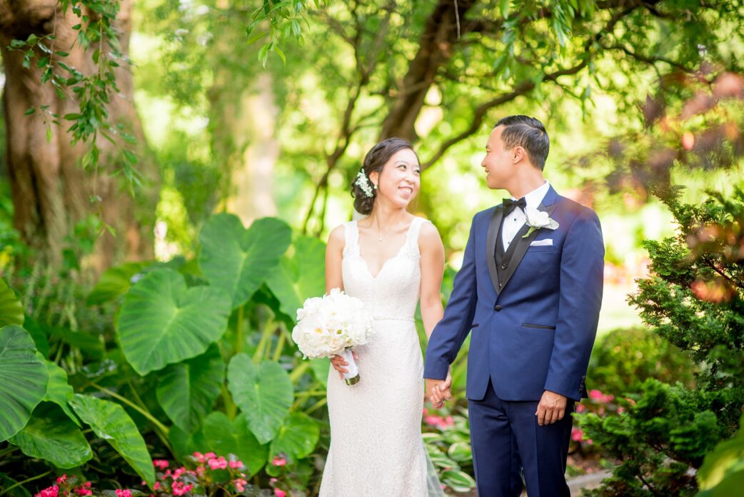 Mikkel Paige Photography pictures of a Westbury Manor wedding on Long Island. Photo of the bride and groom in the garden.