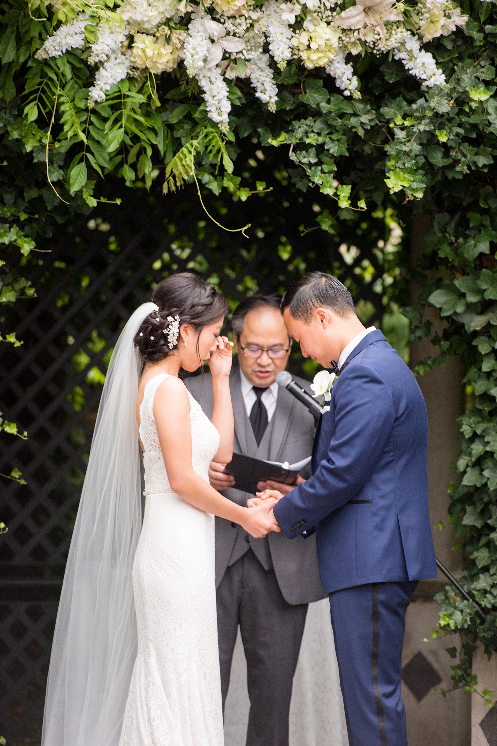 Mikkel Paige Photography pictures of a Westbury Manor wedding on Long Island. An emotional photo of the bride and their outdoor ceremony.