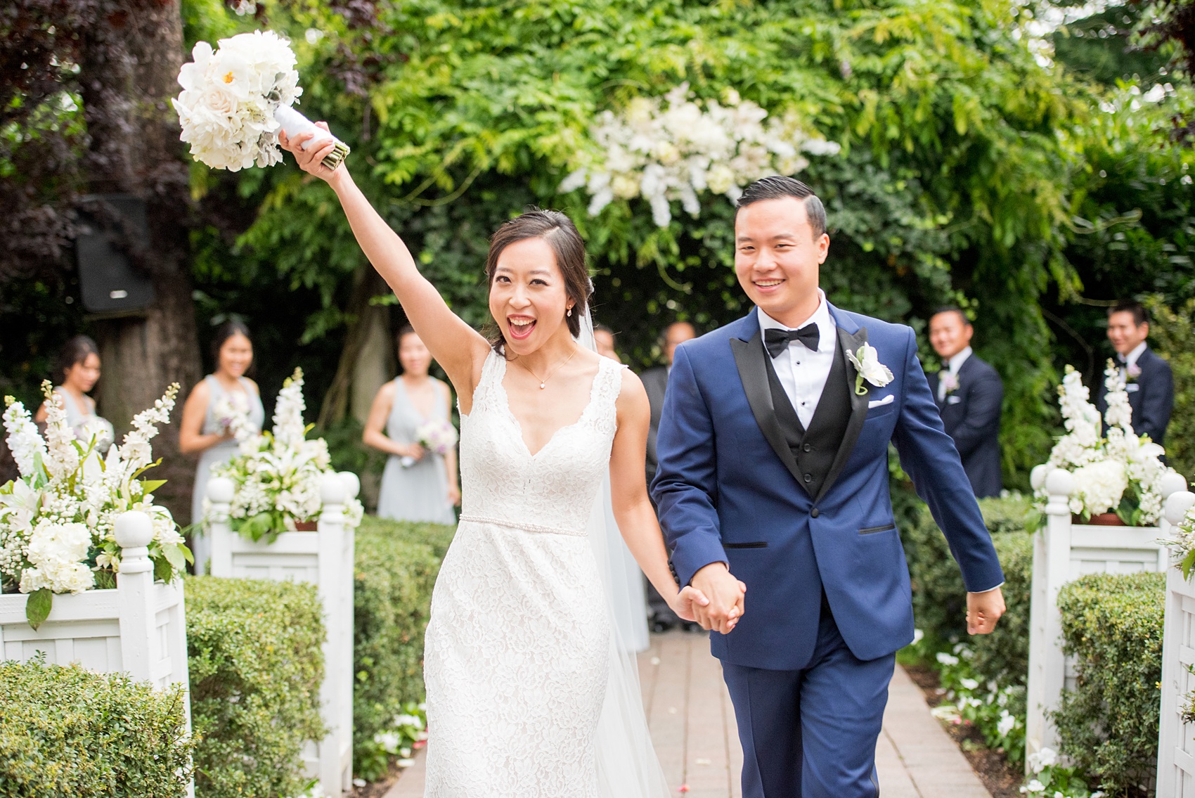 Mikkel Paige Photography pictures of a Westbury Manor wedding on Long Island. An emotional photo of the bride and groom at their outdoor ceremony.