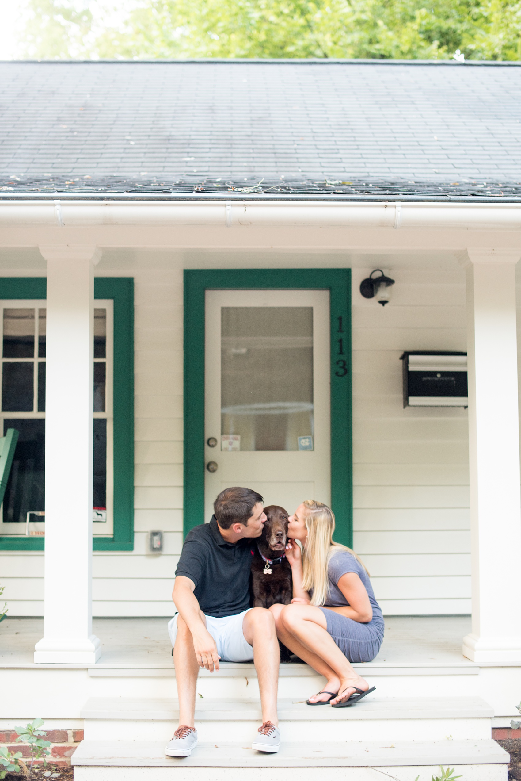 Mikkel Paige Photography pictures of a colorful engagement session in Chapel Hill North Carolina. Photo of the bride and groom with their chocolate lab dog.