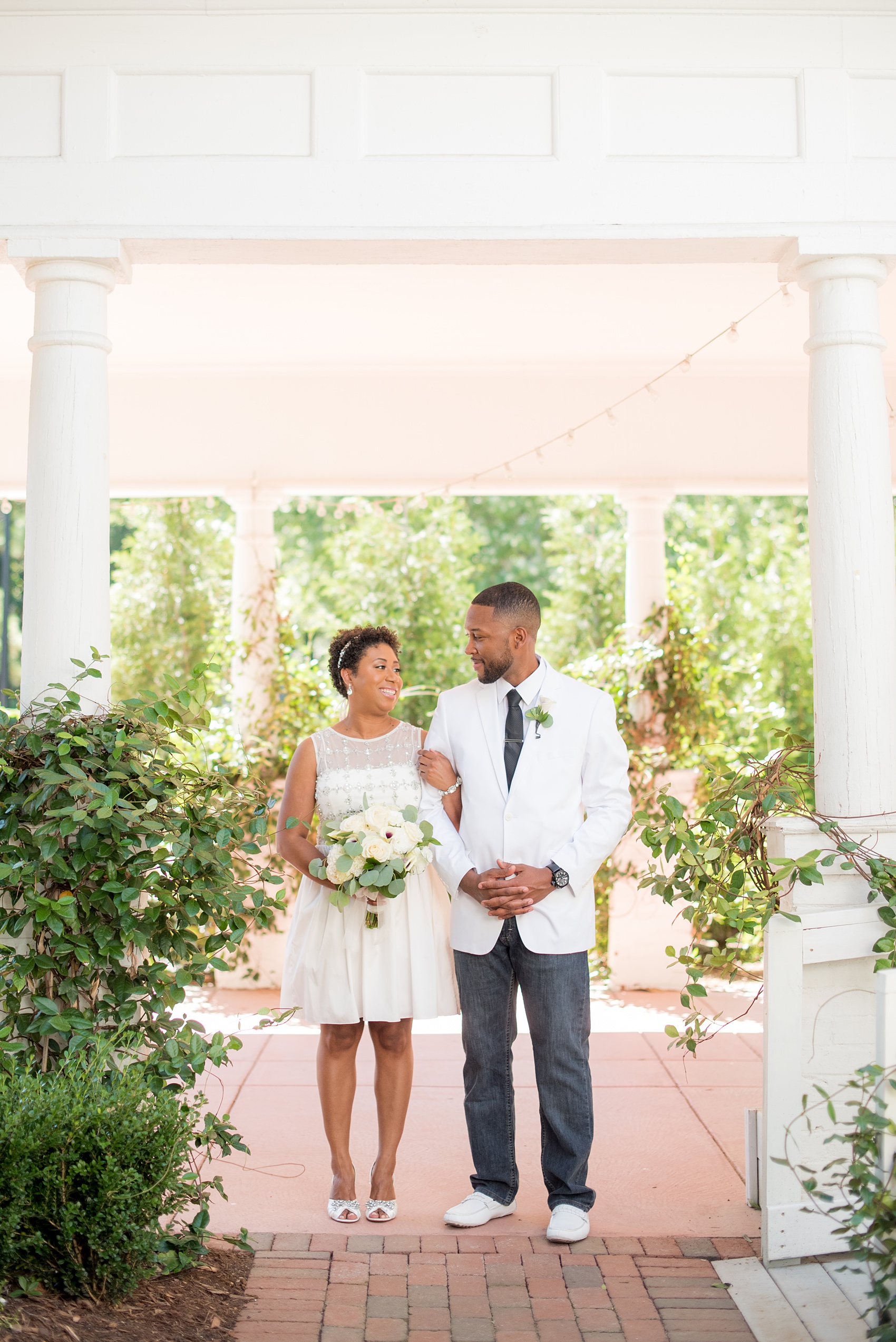Mikkel Paige Photography pictures of a wedding at Leslie-Alford Mim's House in North Carolina for a Mad Dash Weddings event. Photo of the bride and groom in casual elopement attire.