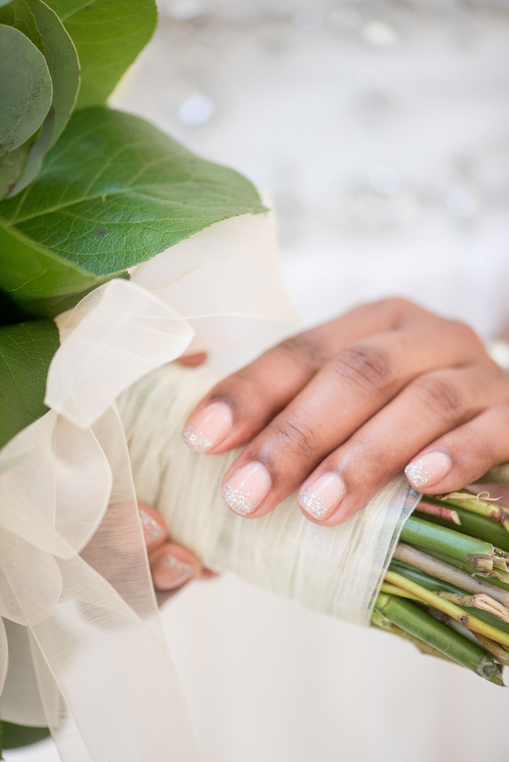 Mikkel Paige Photography pictures of a wedding at Leslie-Alford Mim's House in North Carolina for a Mad Dash Weddings event. Photo of the bride's glitter and light pink gel manicure.