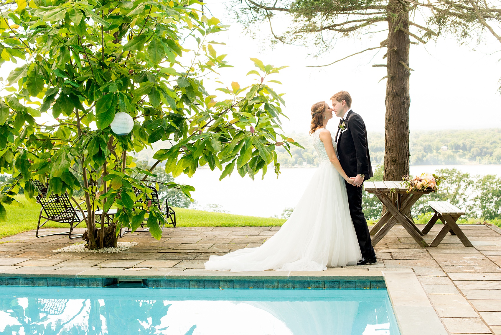 Mikkel Paige Photography photos from a Southwood Estate Wedding in Germantown, New York in the Hudson Valley. Picture of the bride and groom by the pool on the historic property.