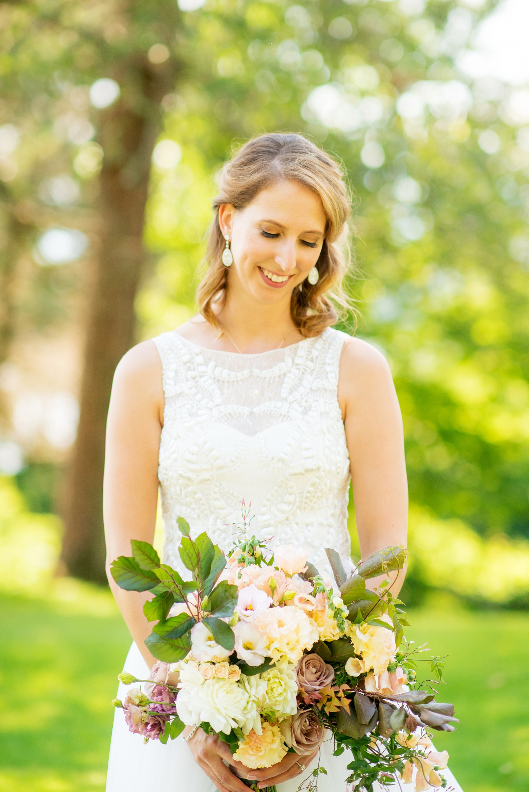 Mikkel Paige Photography photos from a Southwood Estate Wedding in Germantown, New York in the Hudson Valley. Picture of the bride in her embroidered gown.