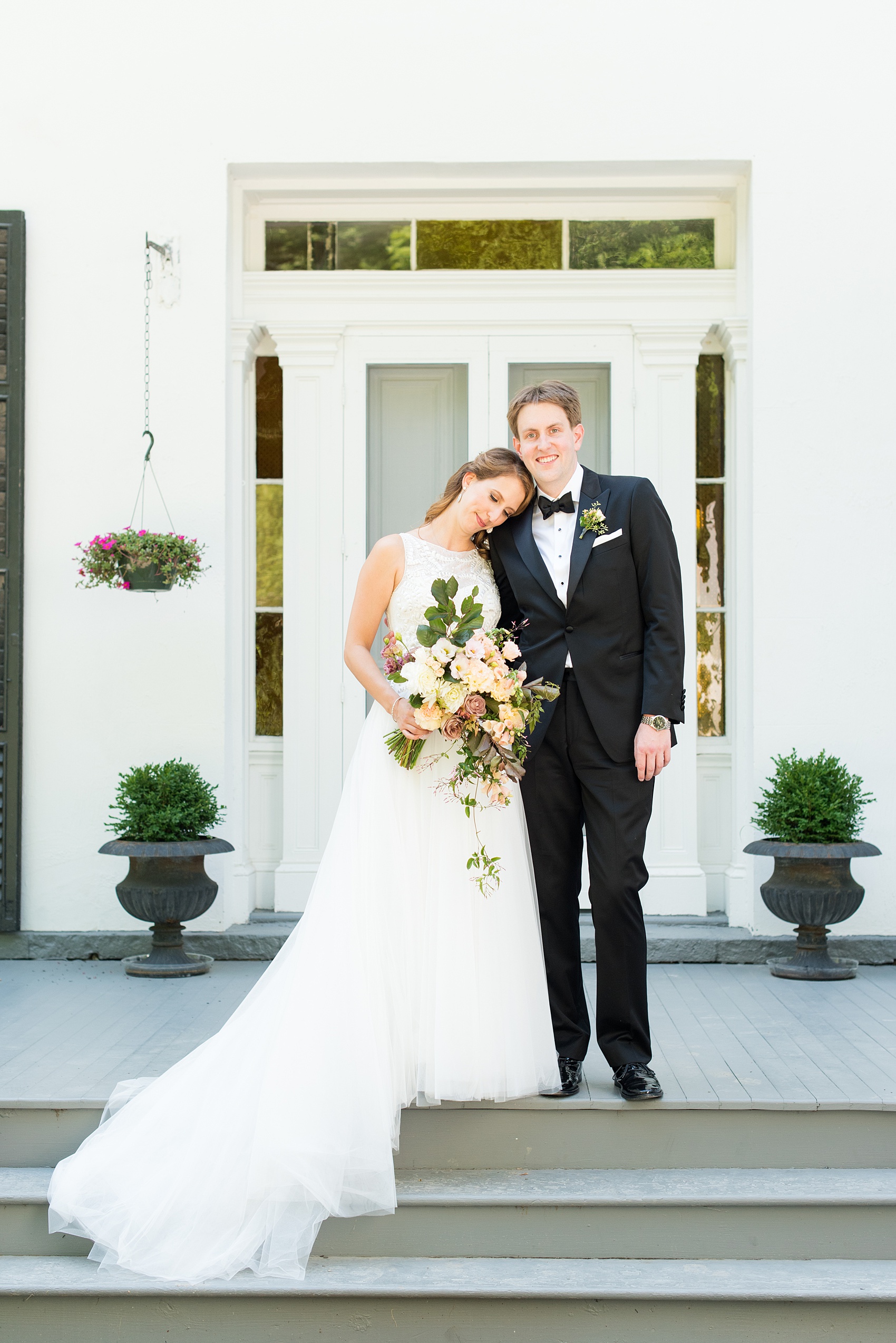 Mikkel Paige Photography photos from a Southwood Estate Wedding in Germantown, New York in the Hudson Valley. Picture of the bride and groom on the front porch of the historic home.