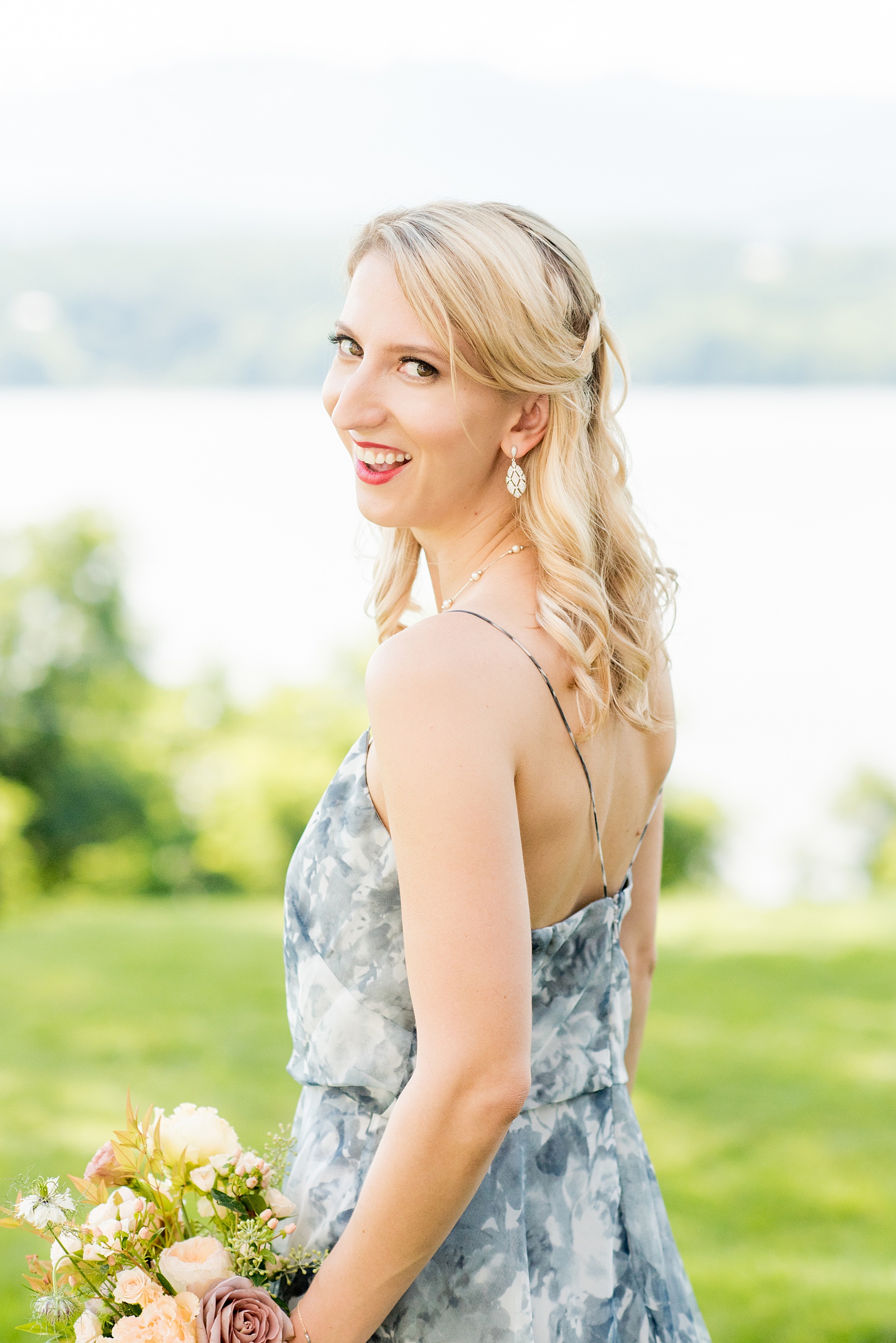 Mikkel Paige Photography photos from a Southwood Estate Wedding in Germantown, New York in the Hudson Valley. Picture of the maid of honor in a blue floral gown.