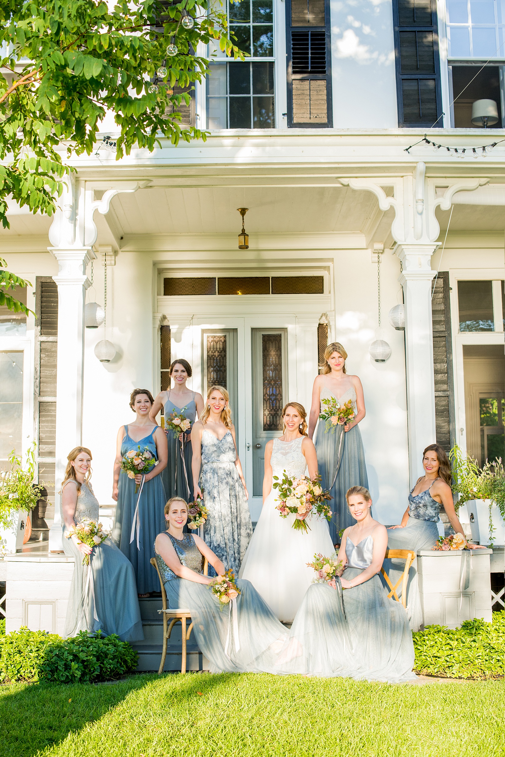 Mikkel Paige Photography photos from a Southwood Estate Wedding in Germantown, New York in the Hudson Valley. Picture of the bridal party in blue on the porch of the historic home.